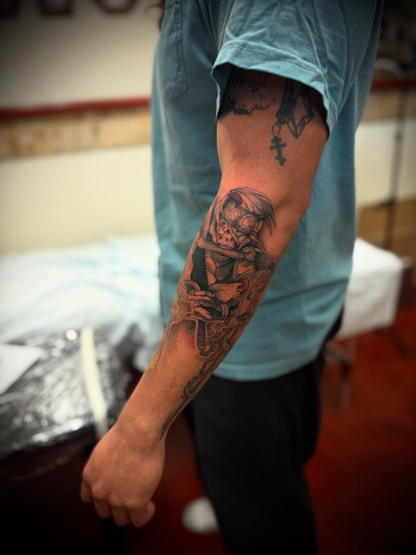 Anime character anime tattoo on the forearm by Julian Olson