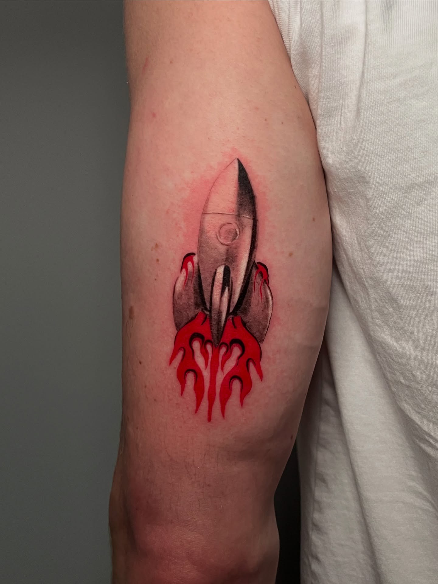 Rocket realism tattoo on the forearm by Jerm Lewis