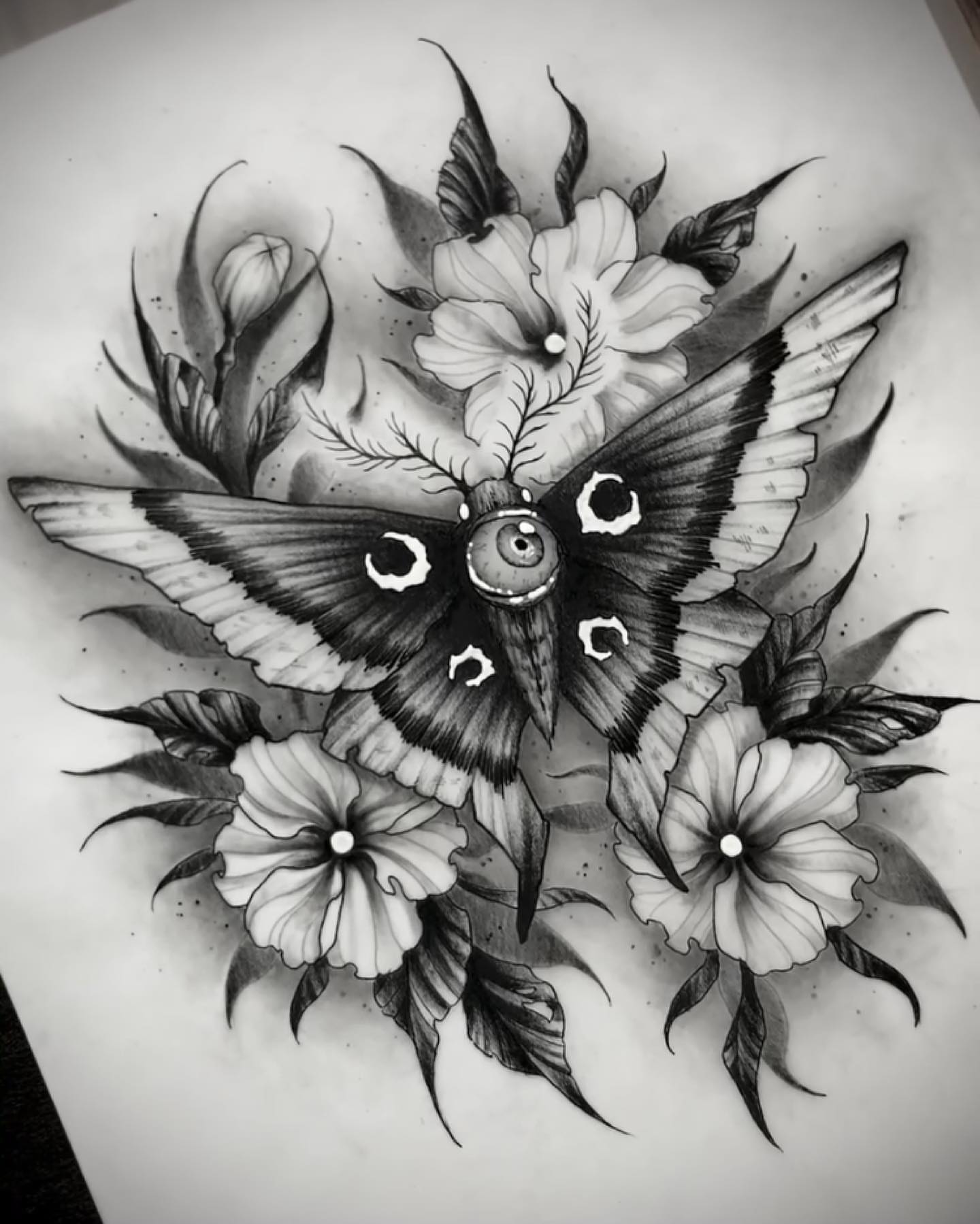Moth and flowers realism tattoo by Griffin Benson