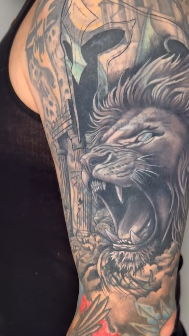 Lion and Spartan helmet realism tattoo by Pat Patterson Florida Tattoo Artist