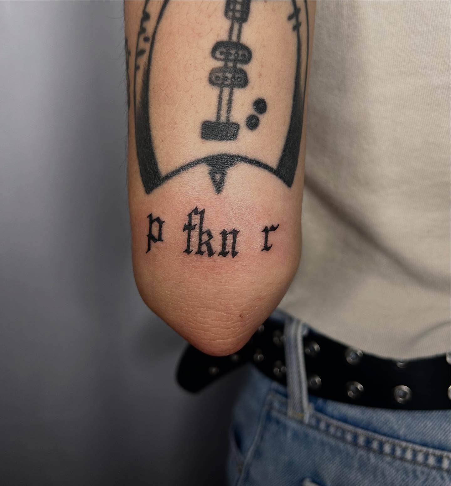 Lettering black and grey tattoo on the forearm by Tash ๐โ๐ฉ