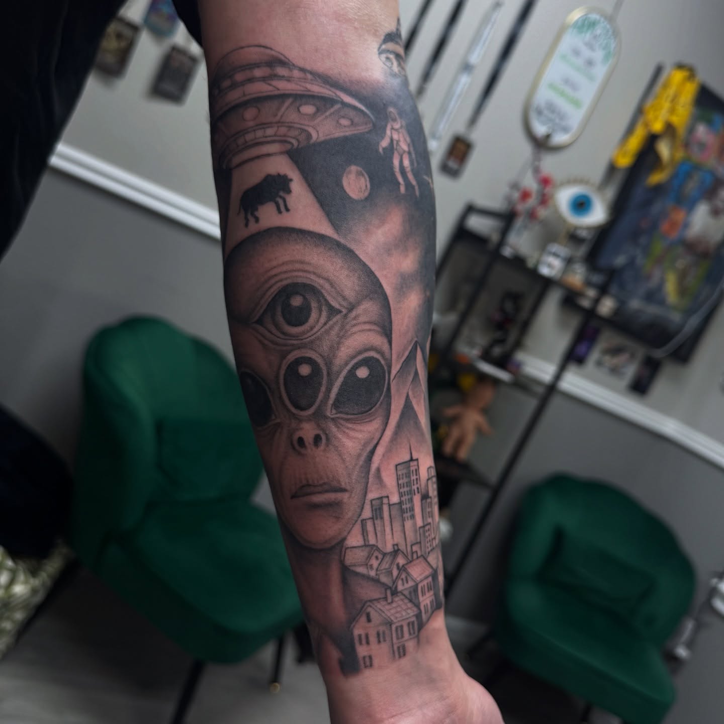 Alien head realism tattoo on the forearm by Mo Dinero🎰