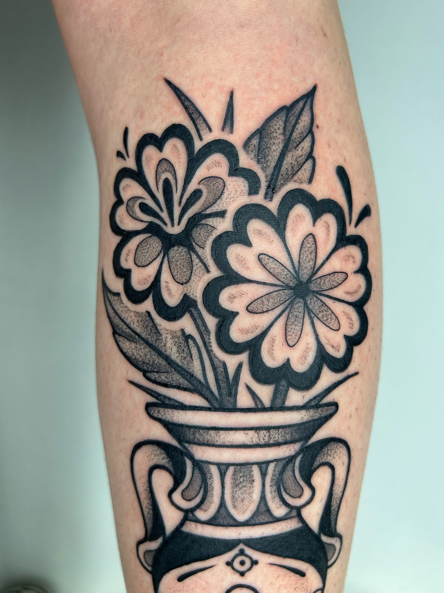 Flowers in vase American traditional tattoo on the forearm by Aaron Murray ✨ Michigan Tattoo Artist