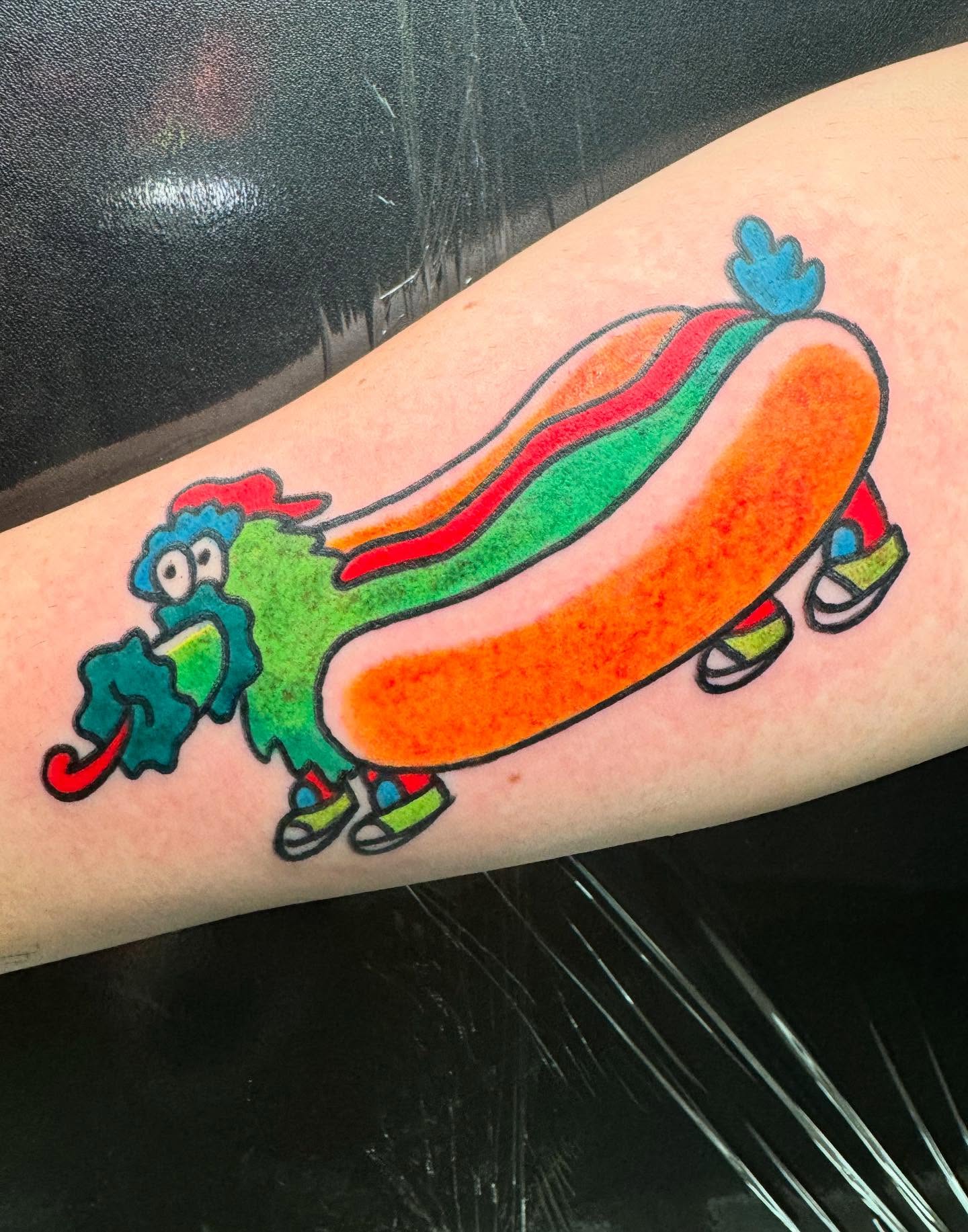 Hot dog new school tattoo on the forearm by Perrey