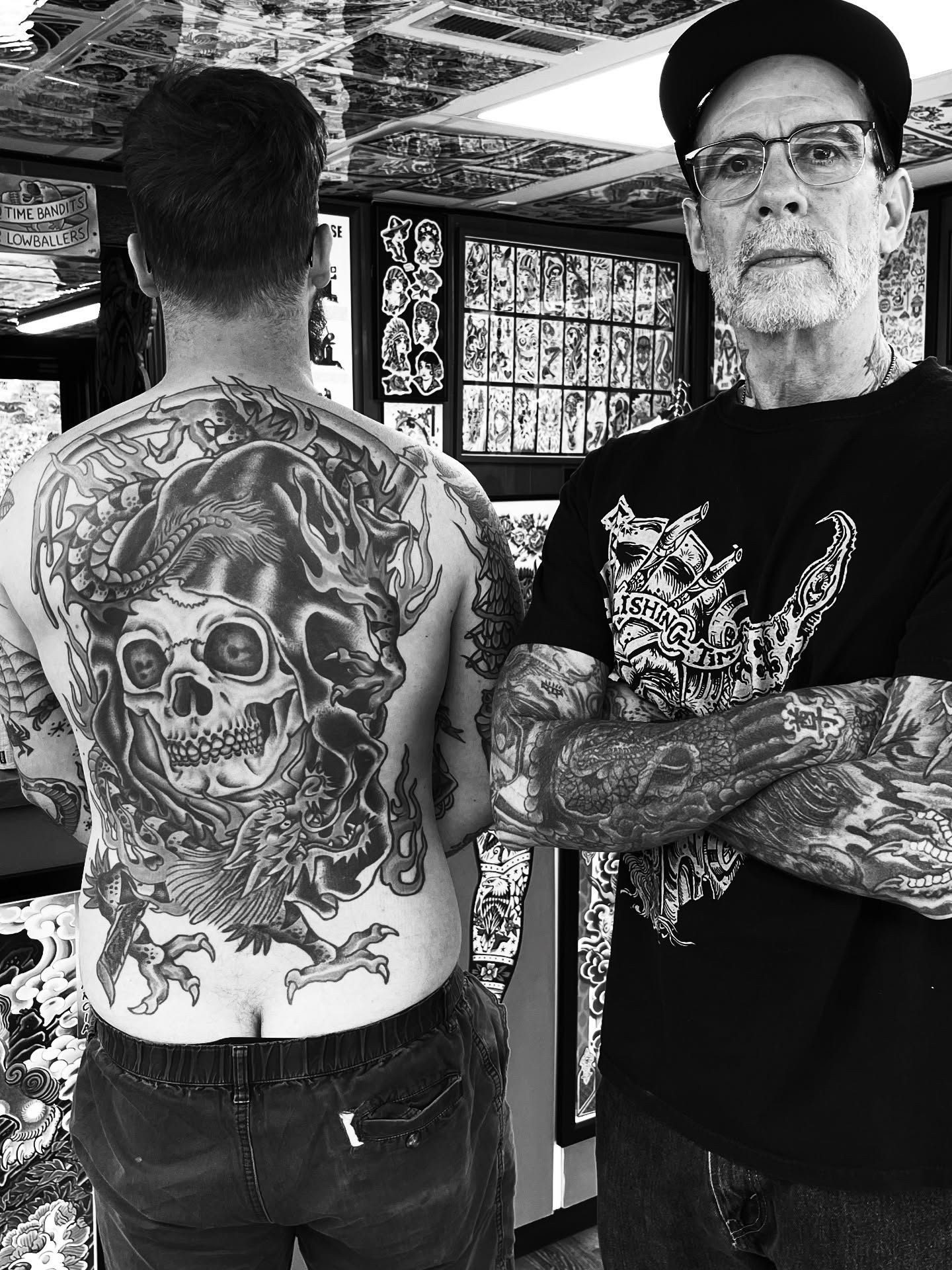 Skull and flames American traditional tattoo on the back by Steve Tiberi