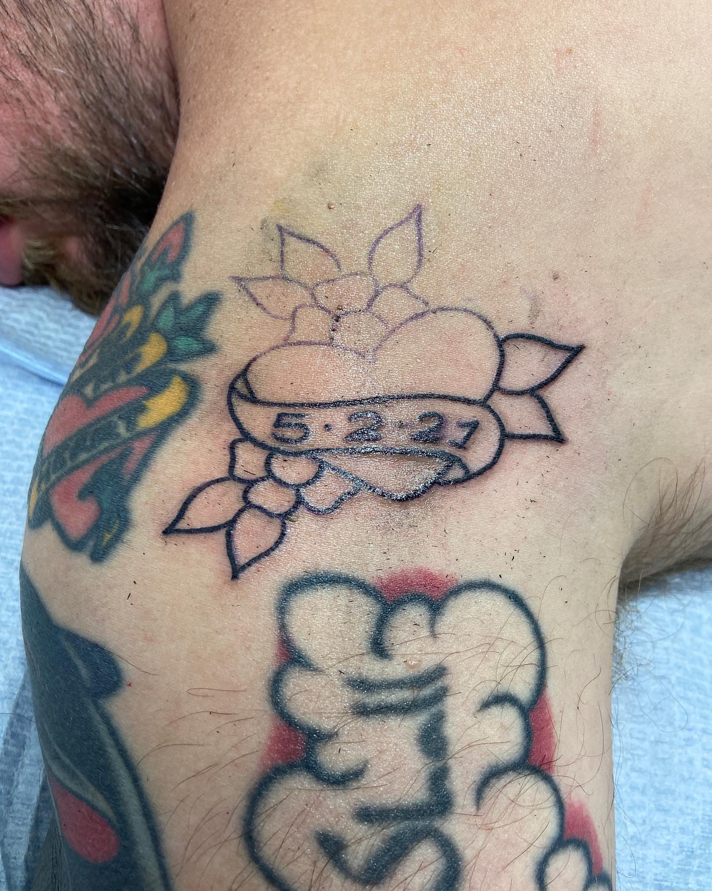 Lotus flower American traditional tattoo on the forearm by Lucía