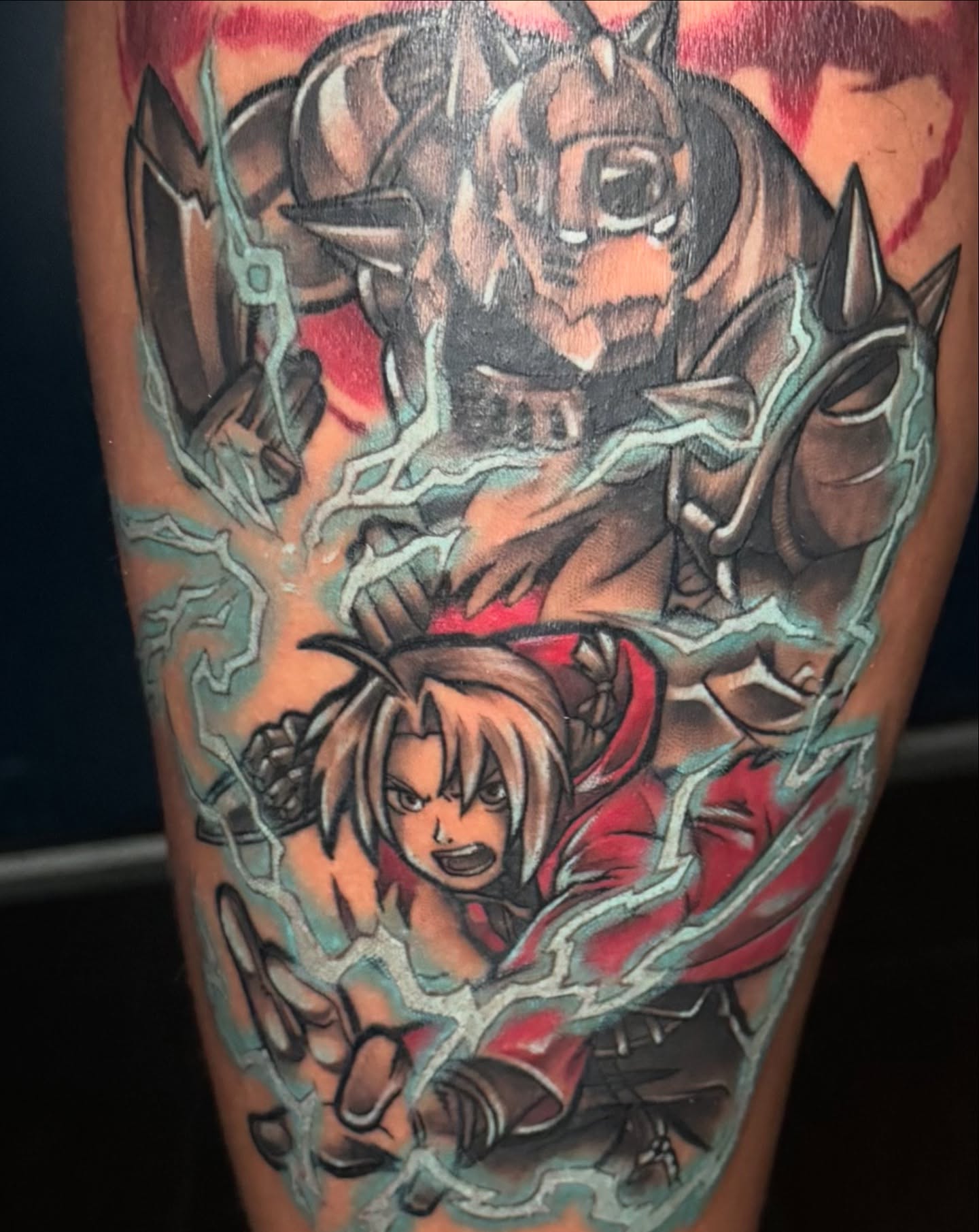 Anime characters anime tattoo on the forearm by Bri
