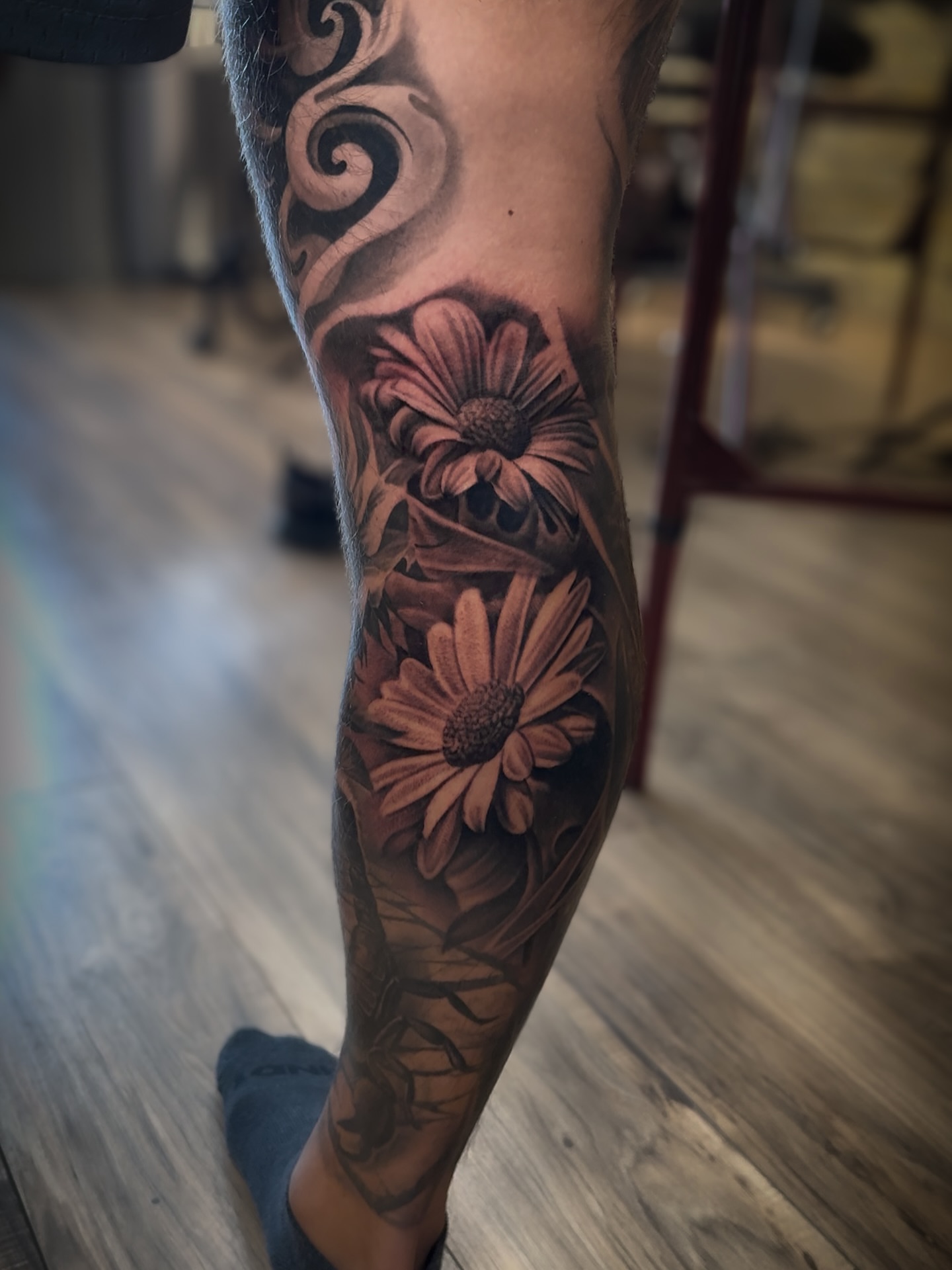 Daisies realism tattoo on the forearm by Aaron, Milwaukee, Wisconsin