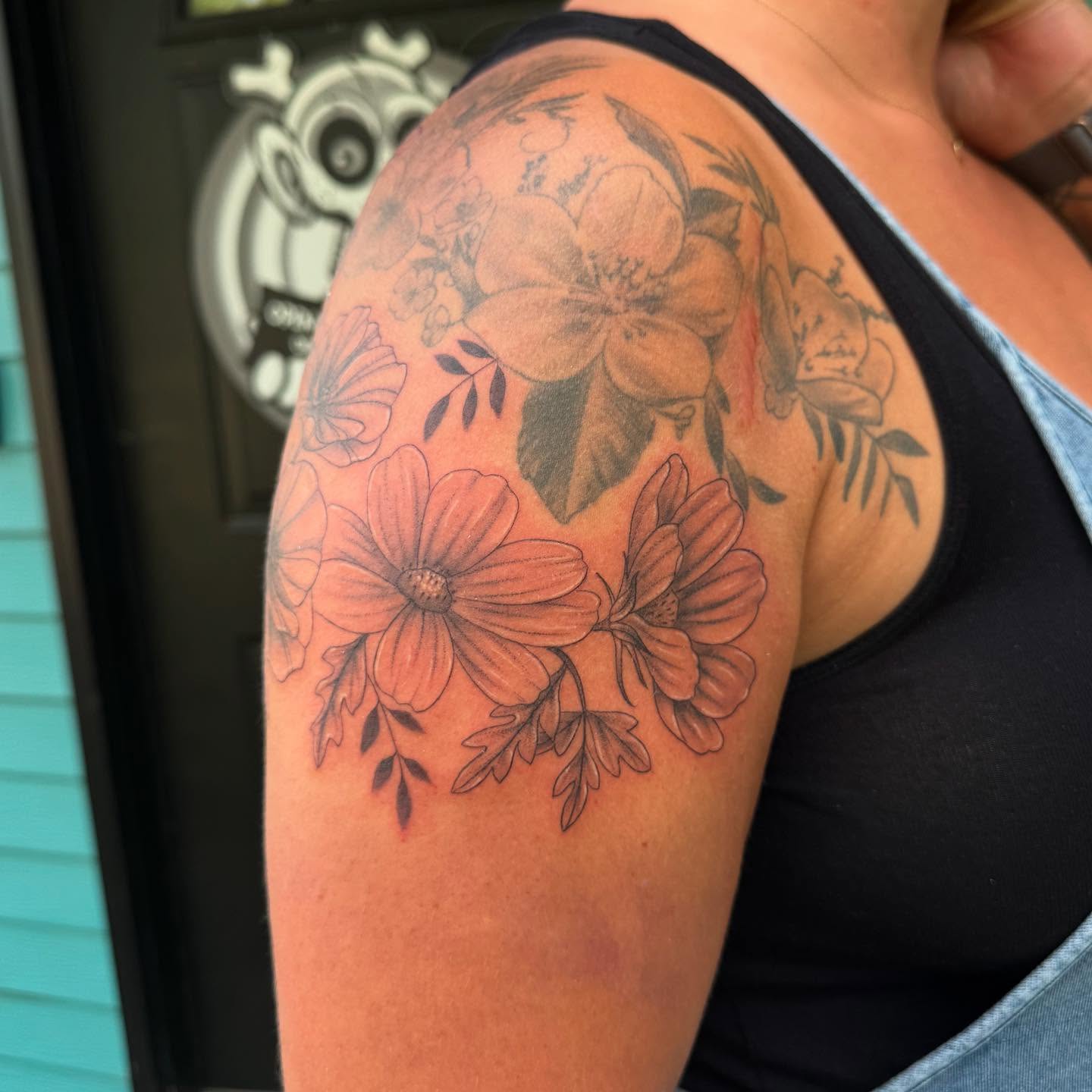 Floral arrangement black and grey tattoo on the shoulder by Leslea Hipp