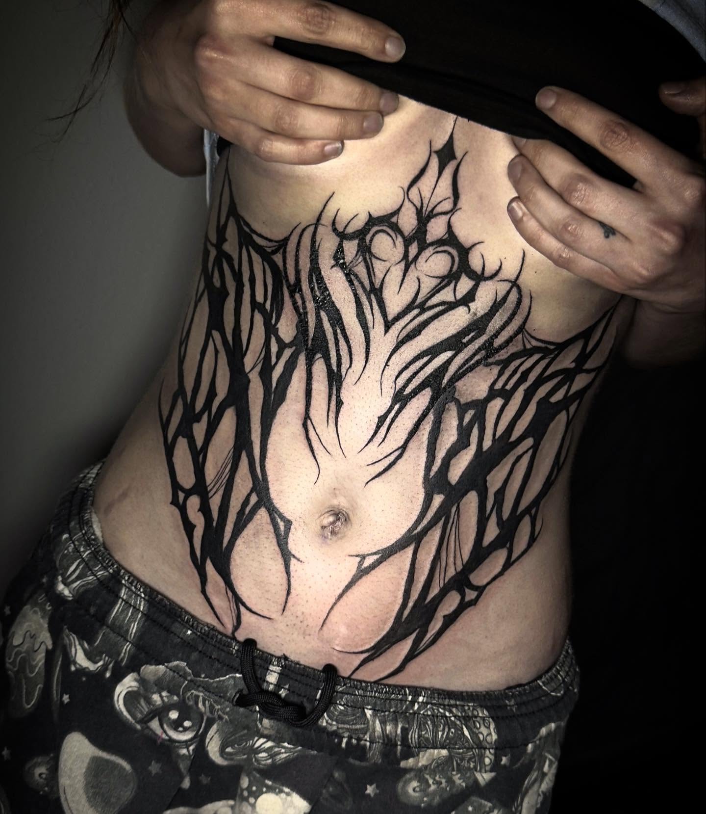 Abstract branches black and grey tattoo on the torso by Las Vegas Tattoo Artist