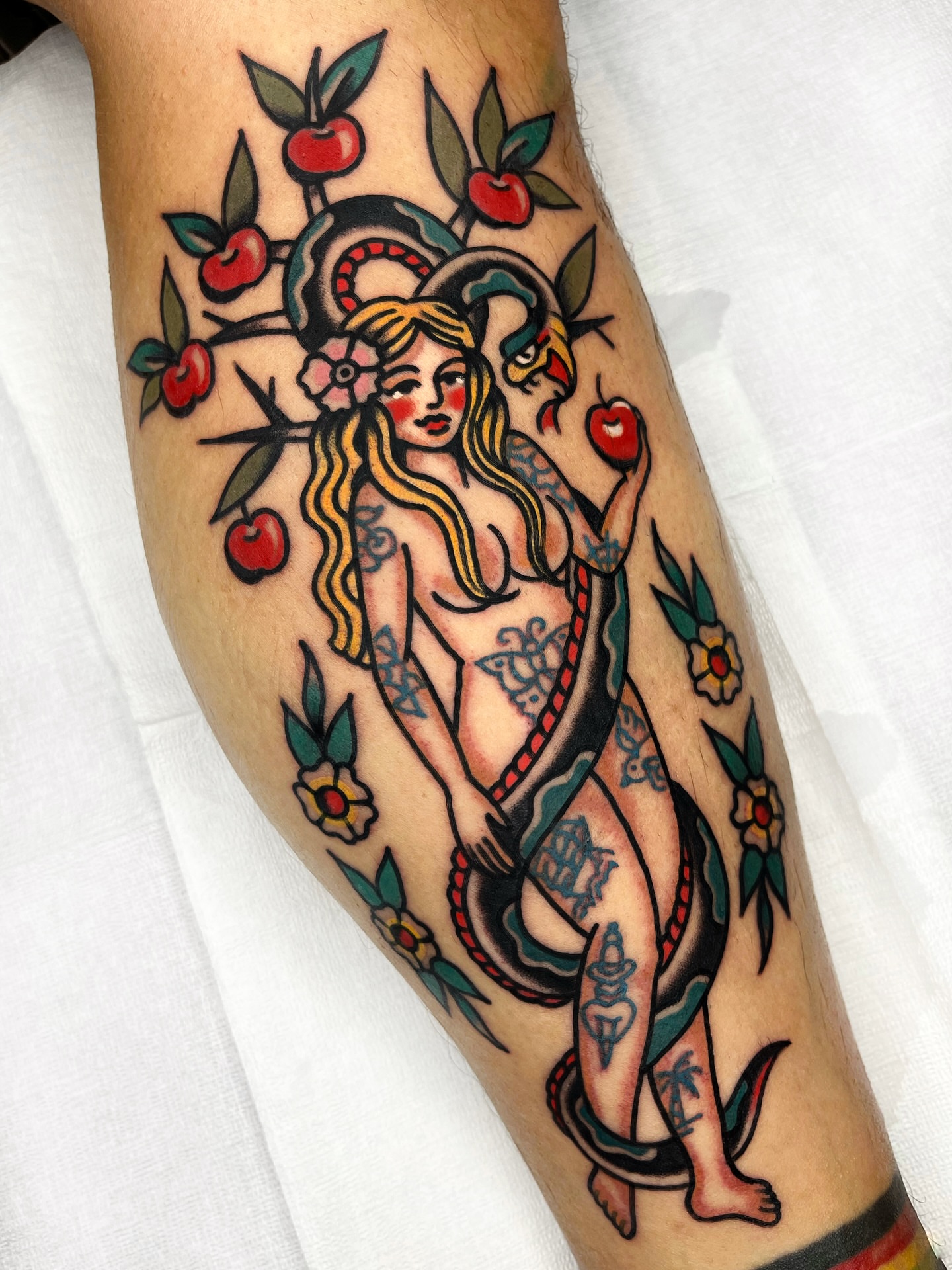 Serpent and woman American traditional tattoo on the forearm by 올드스쿨타투 레드립