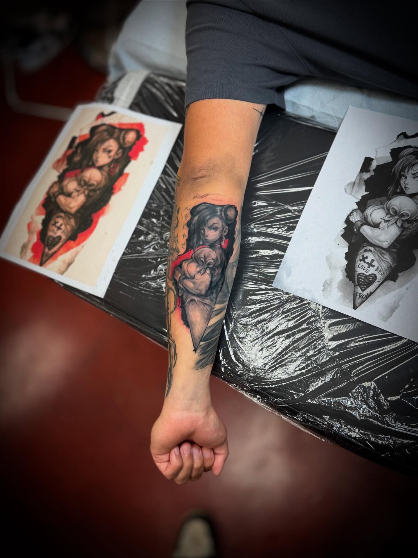 Woman with sword American traditional tattoo on the forearm by Julian Olson