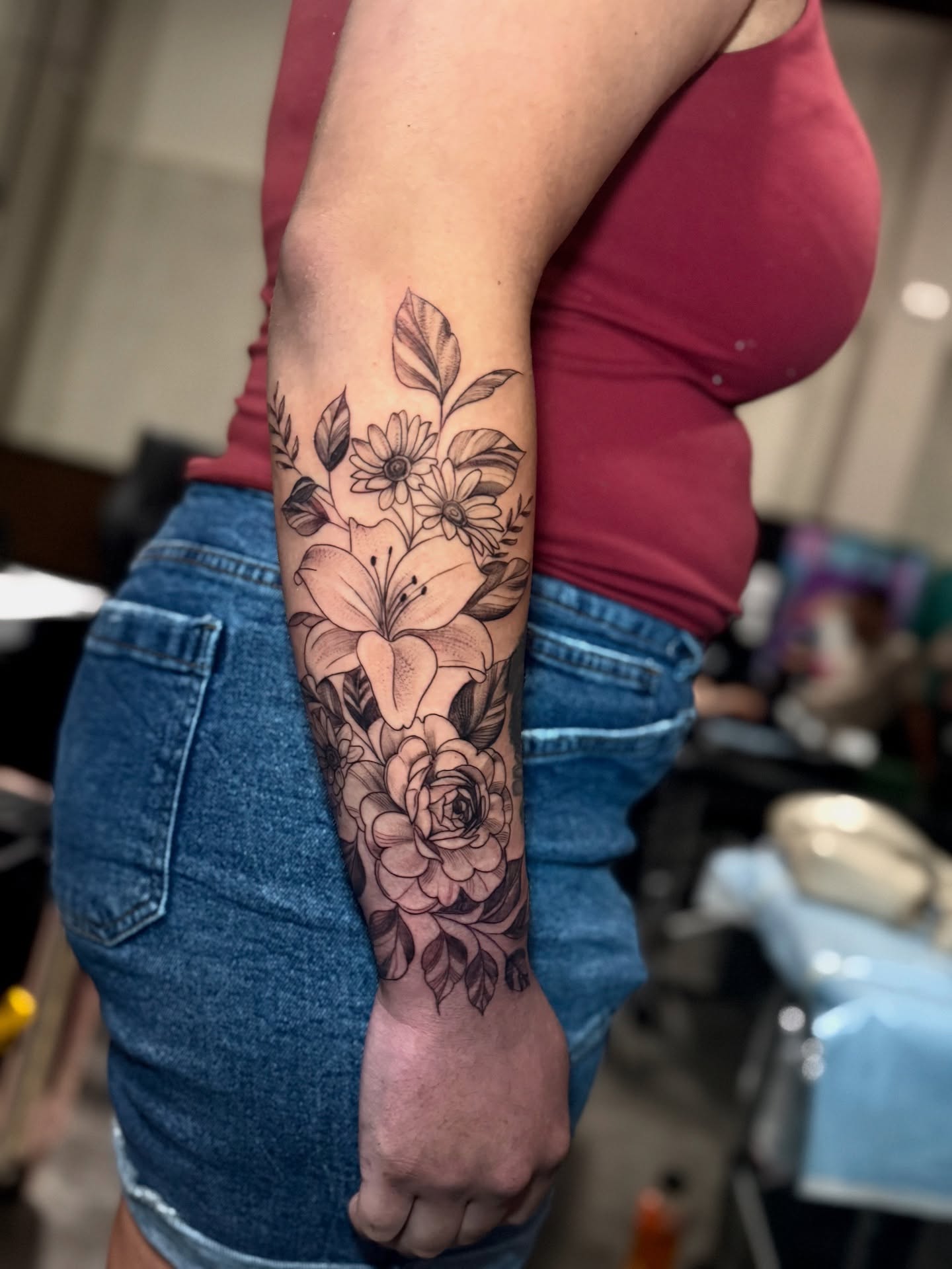 Floral arrangement black and grey tattoo on the forearm by Paola Pineda Tattoo, Knoxville, Tennessee