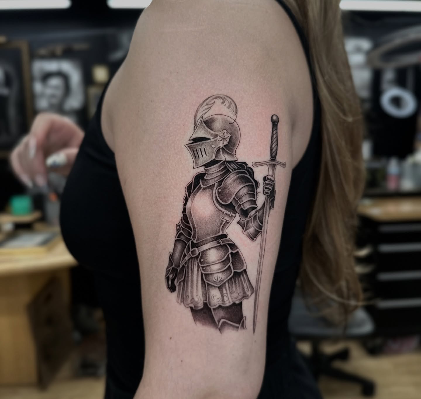 Knight in armor black and grey tattoo on the upper arm by πΈππππ