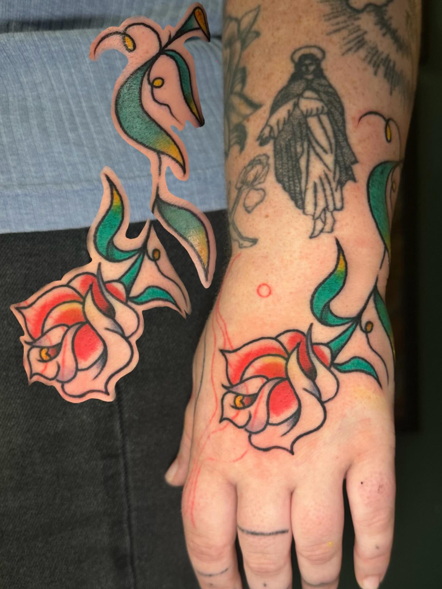 Religious figure with roses American traditional tattoo on the forearm by Olive Kelley
