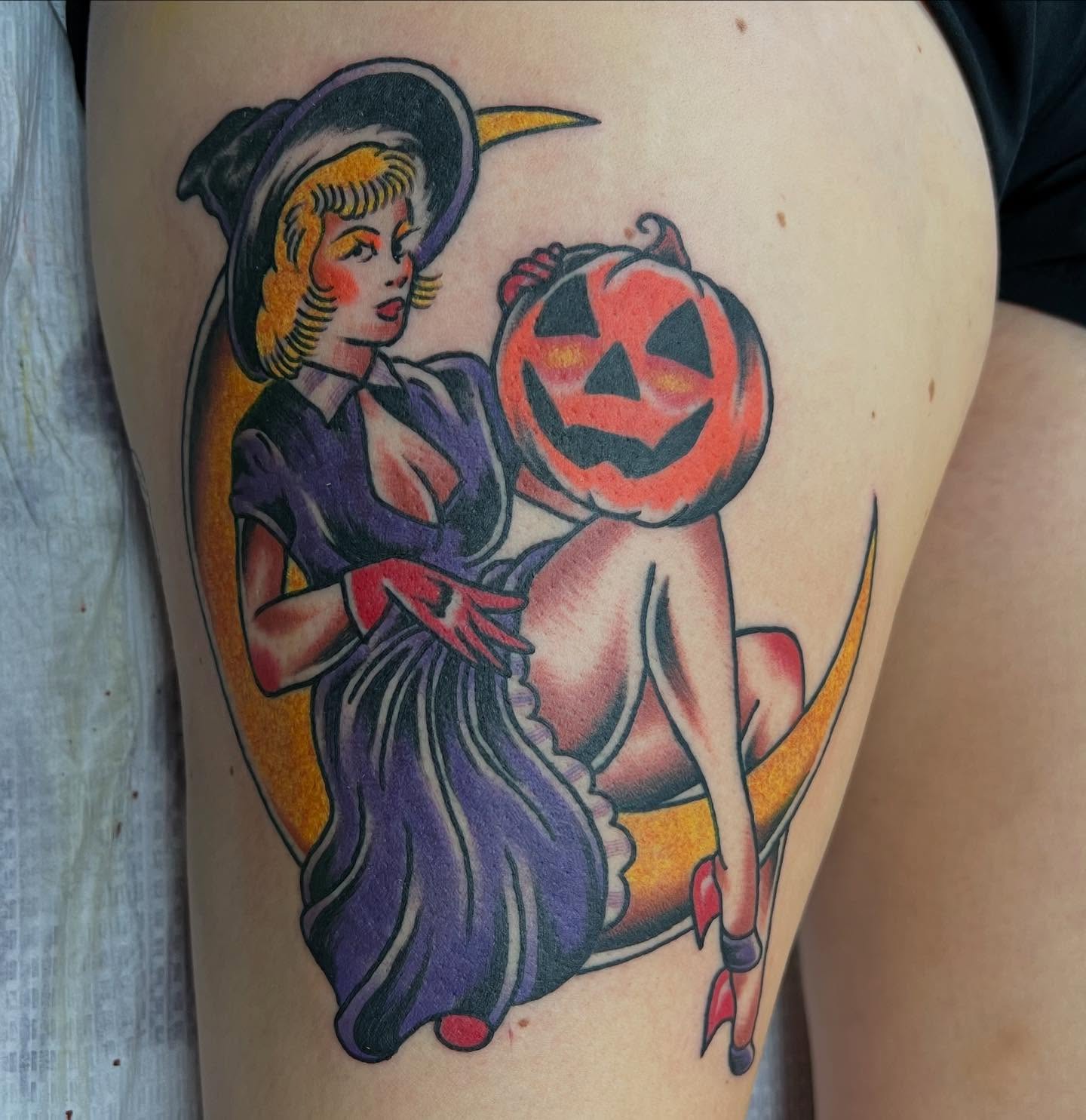 Witch and pumpkin American traditional tattoo on the thigh by doodle