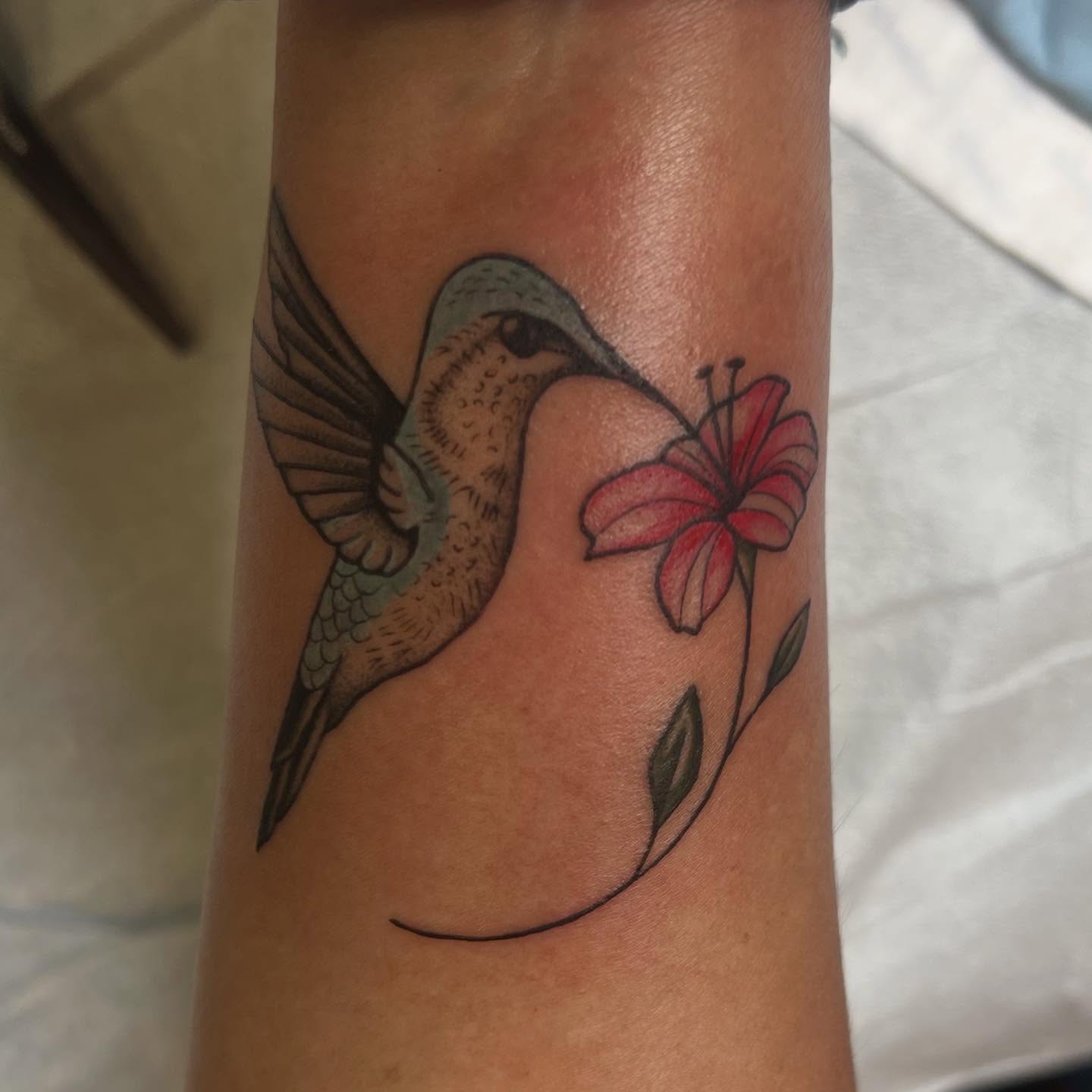 Hummingbird and flower realism tattoo on the forearm by Erika Donn, Portland, Oregon