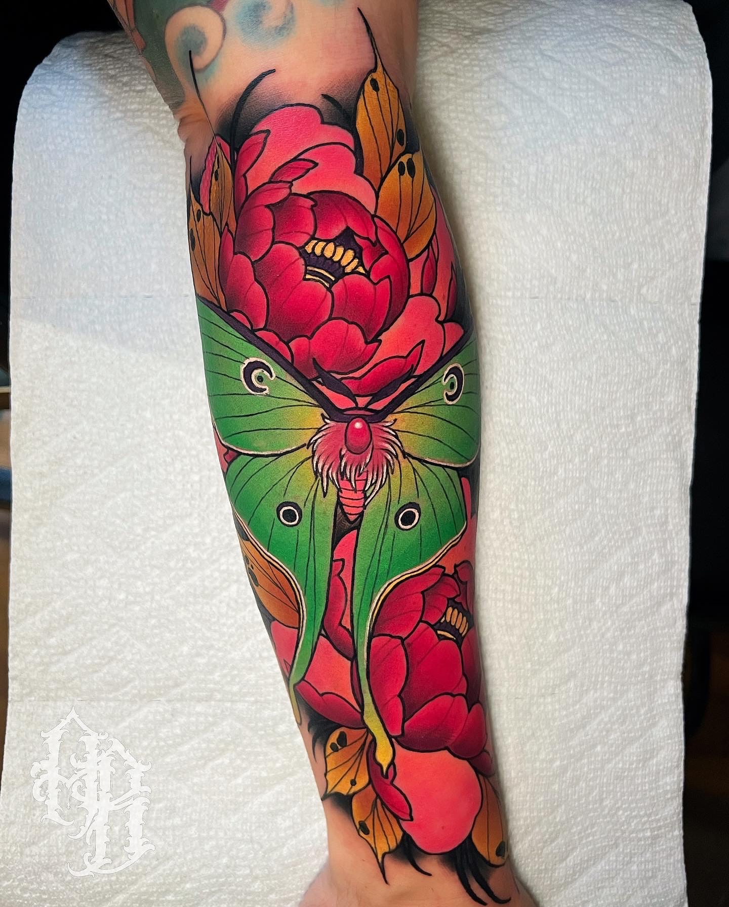 Peony and butterfly new school tattoo on the forearm by Austin Britt