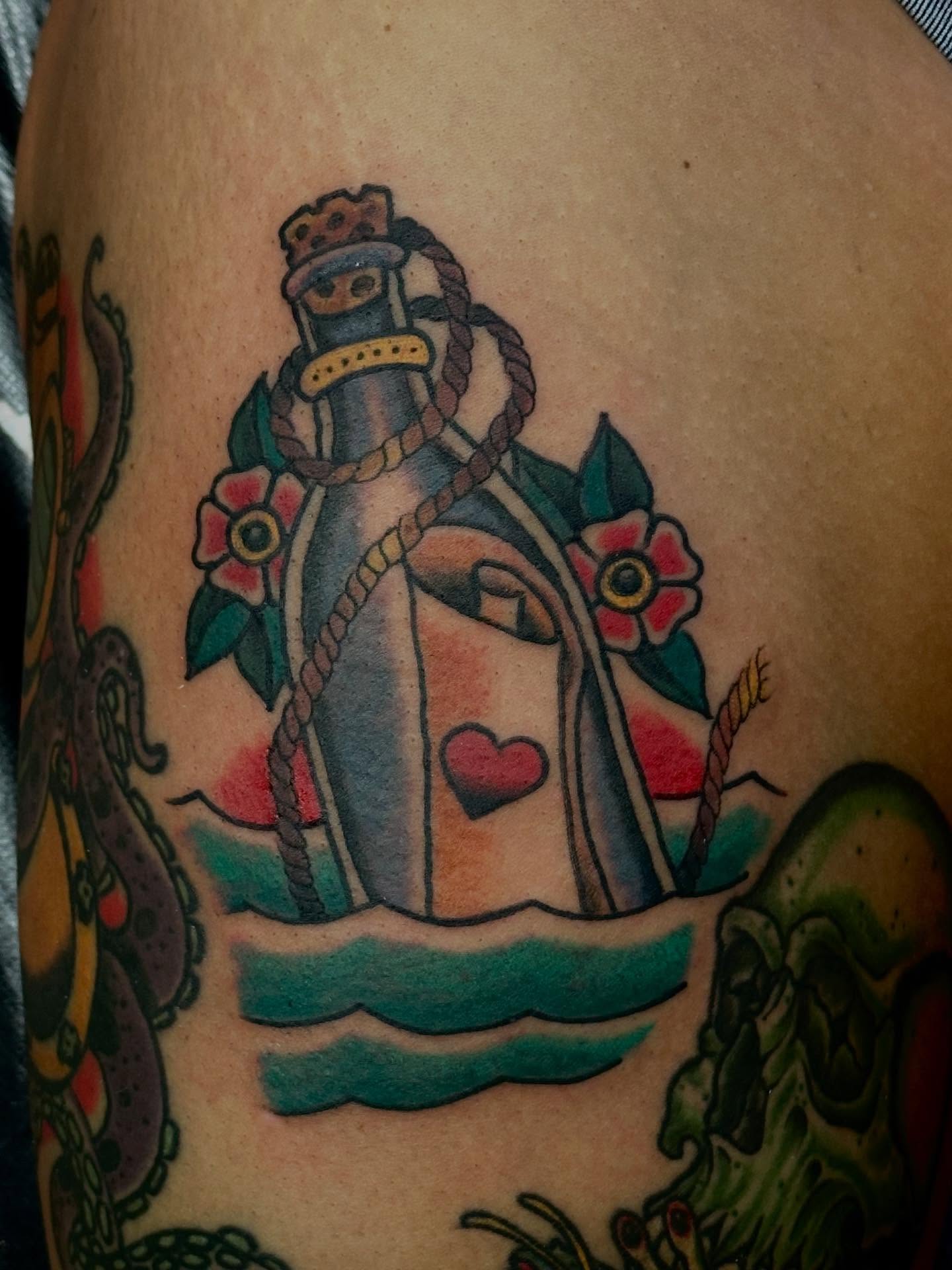 Ship in a bottle American traditional tattoo on the thigh by Jordan Rubin, Dunedin, Florida