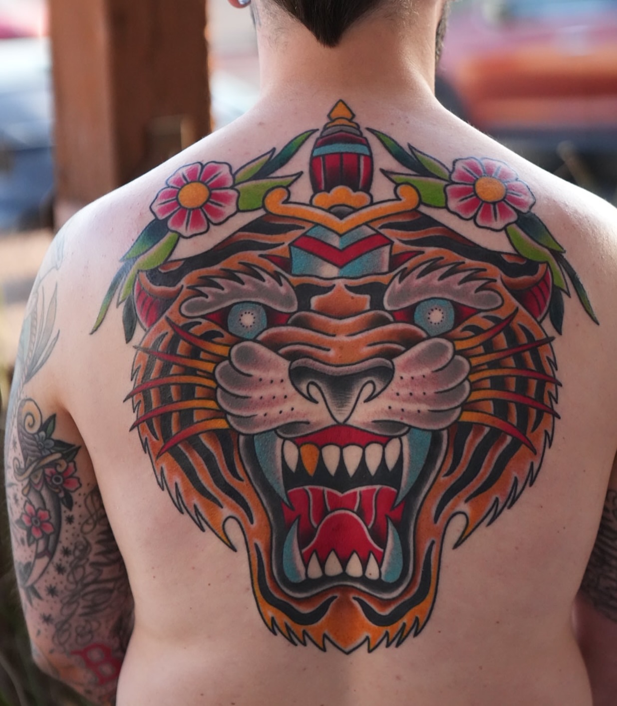 Tiger head American traditional tattoo on the back by Donovan hernandez