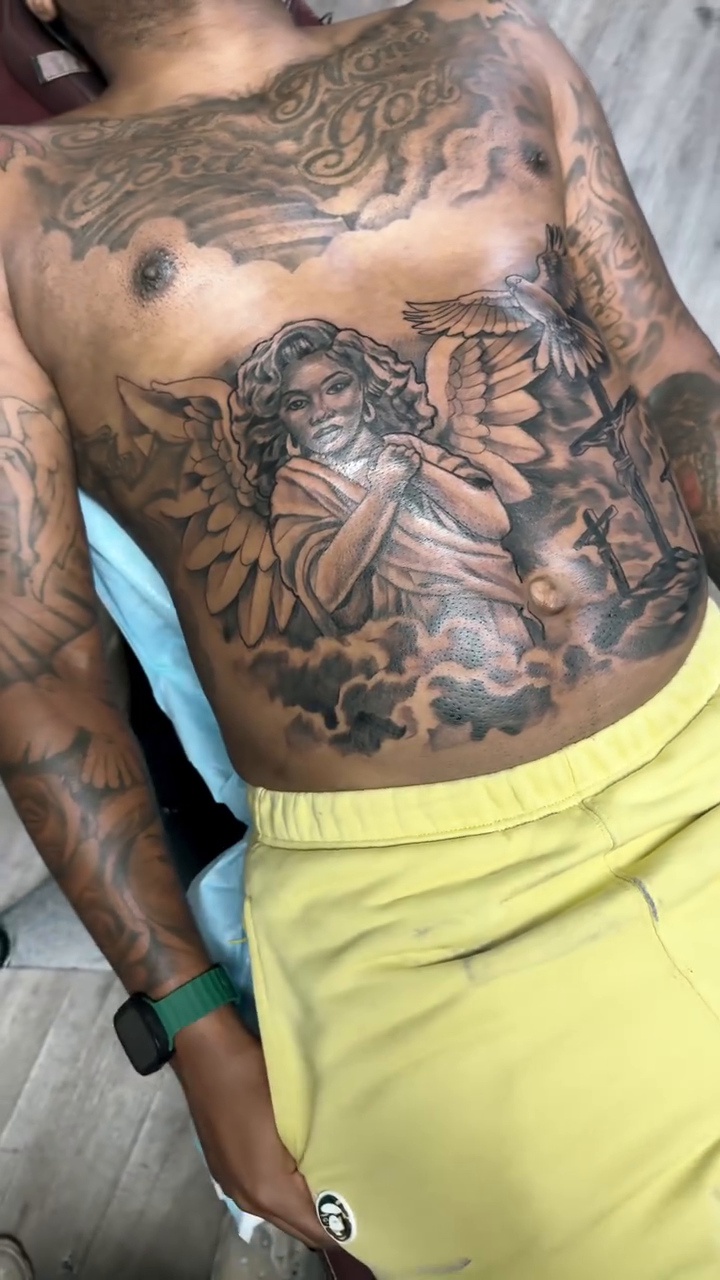 Angel with dove and cross realism tattoo by Jared McGee