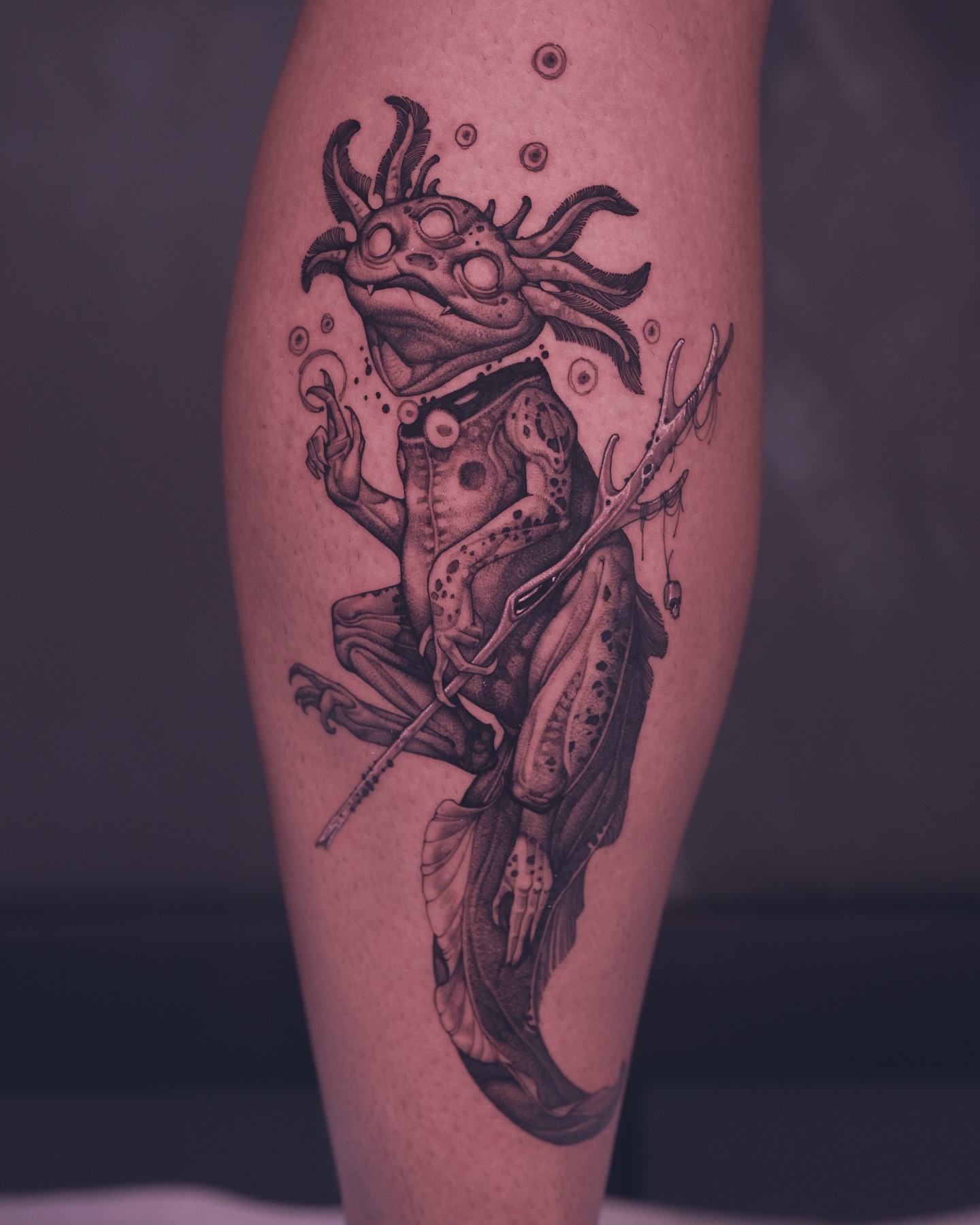Frog-like creature dotwork tattoo on the calf by 9rukim