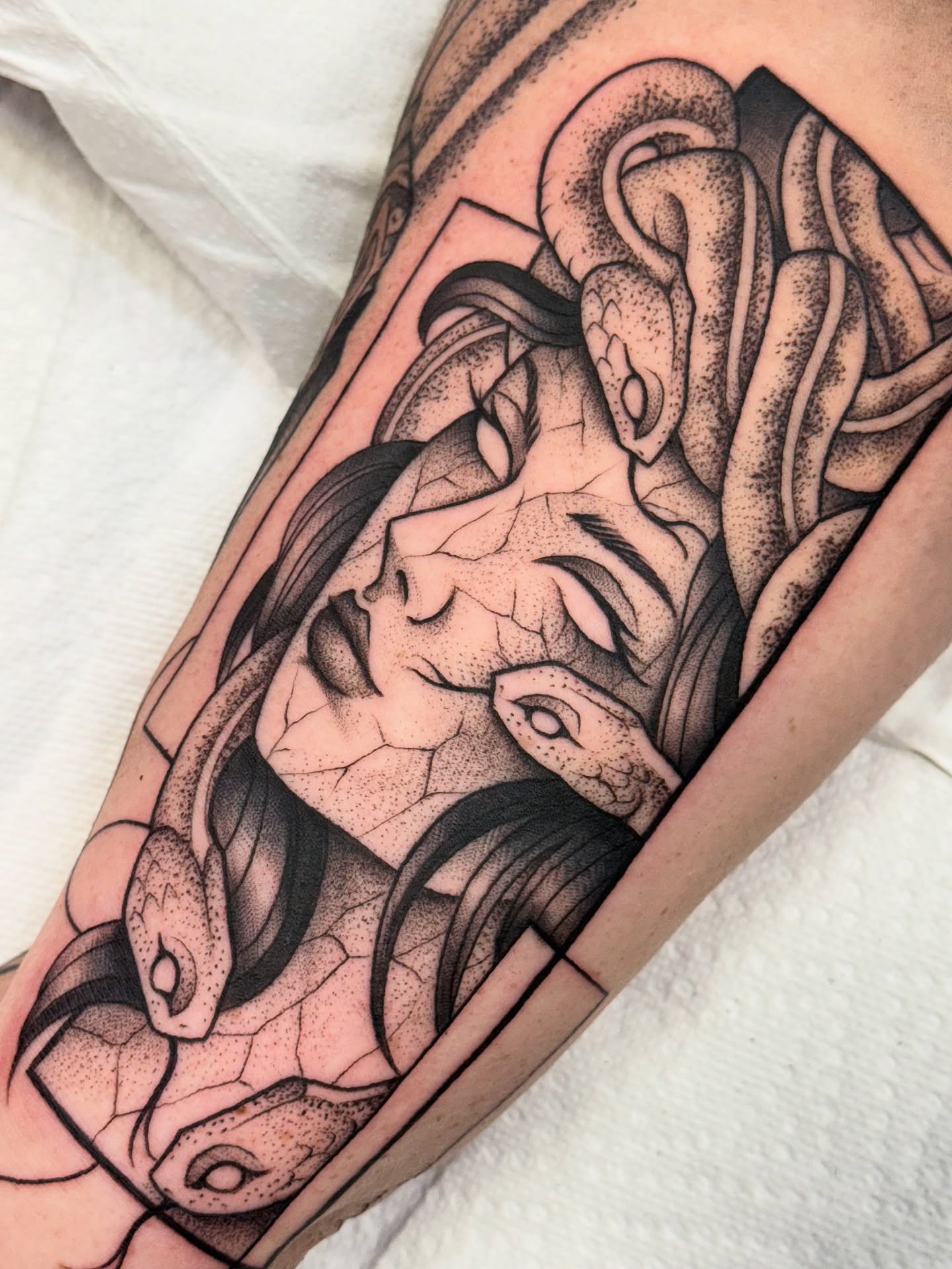 Woman with snakes dotwork tattoo on the forearm by jenna clark🎨