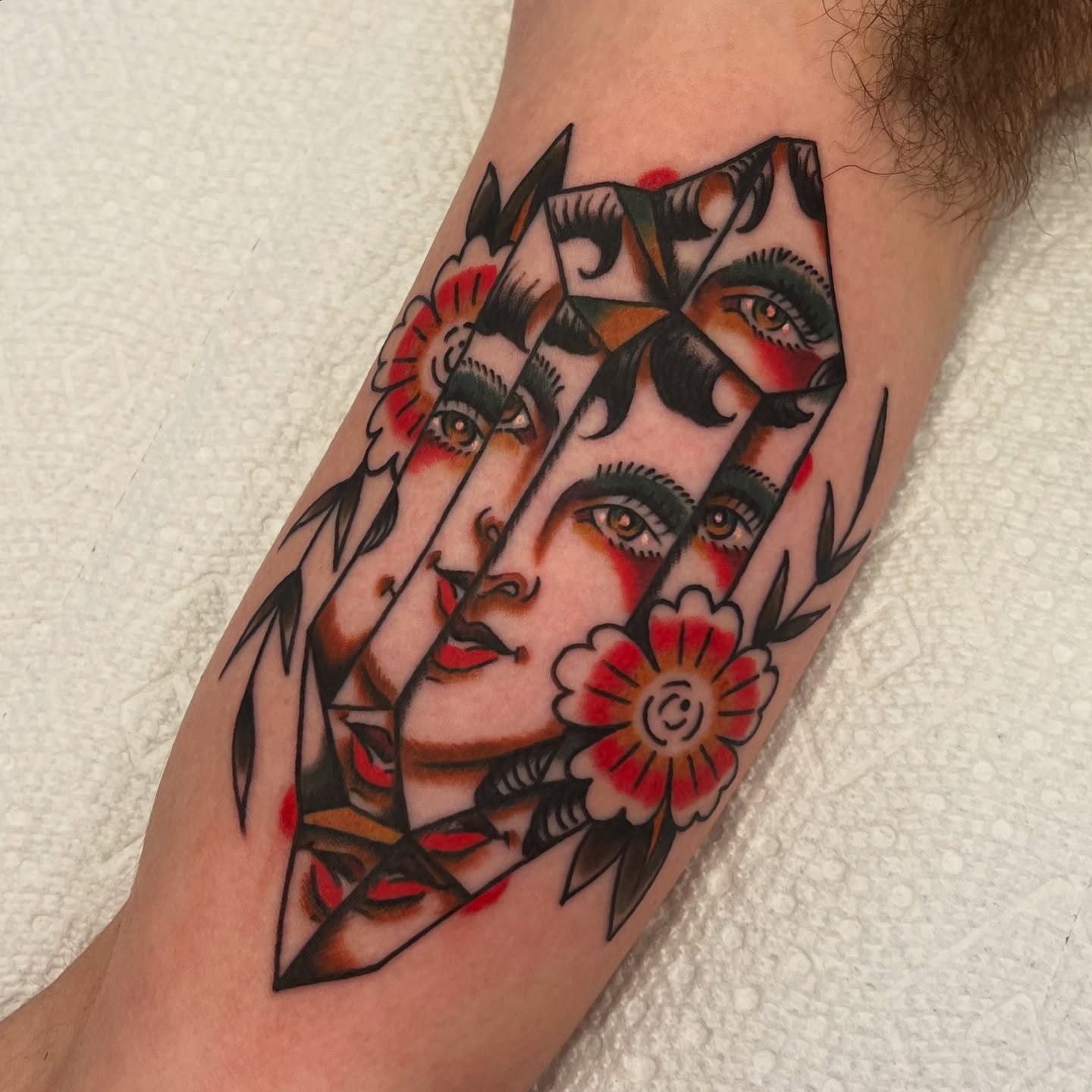 Geometric portrait American traditional tattoo on the forearm by @brandonhuckabey, Denver, Colorado
