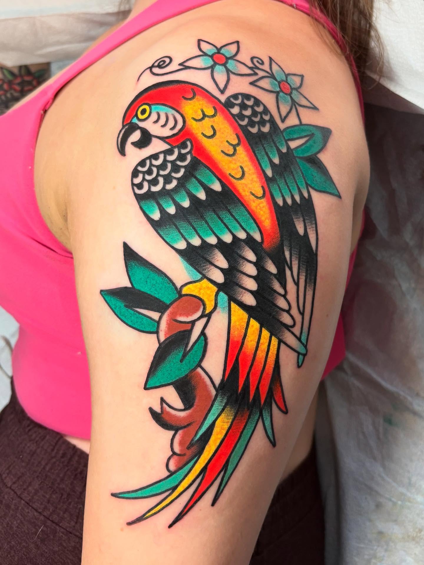 Parrot American traditional tattoo on the shoulder by Traditional Tattooing
