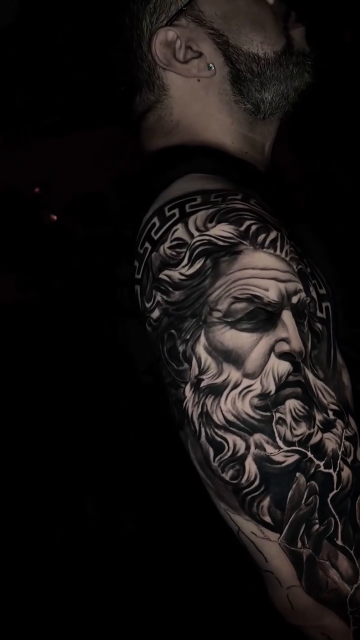 Greek god portrait realism tattoo by Charlie Soto