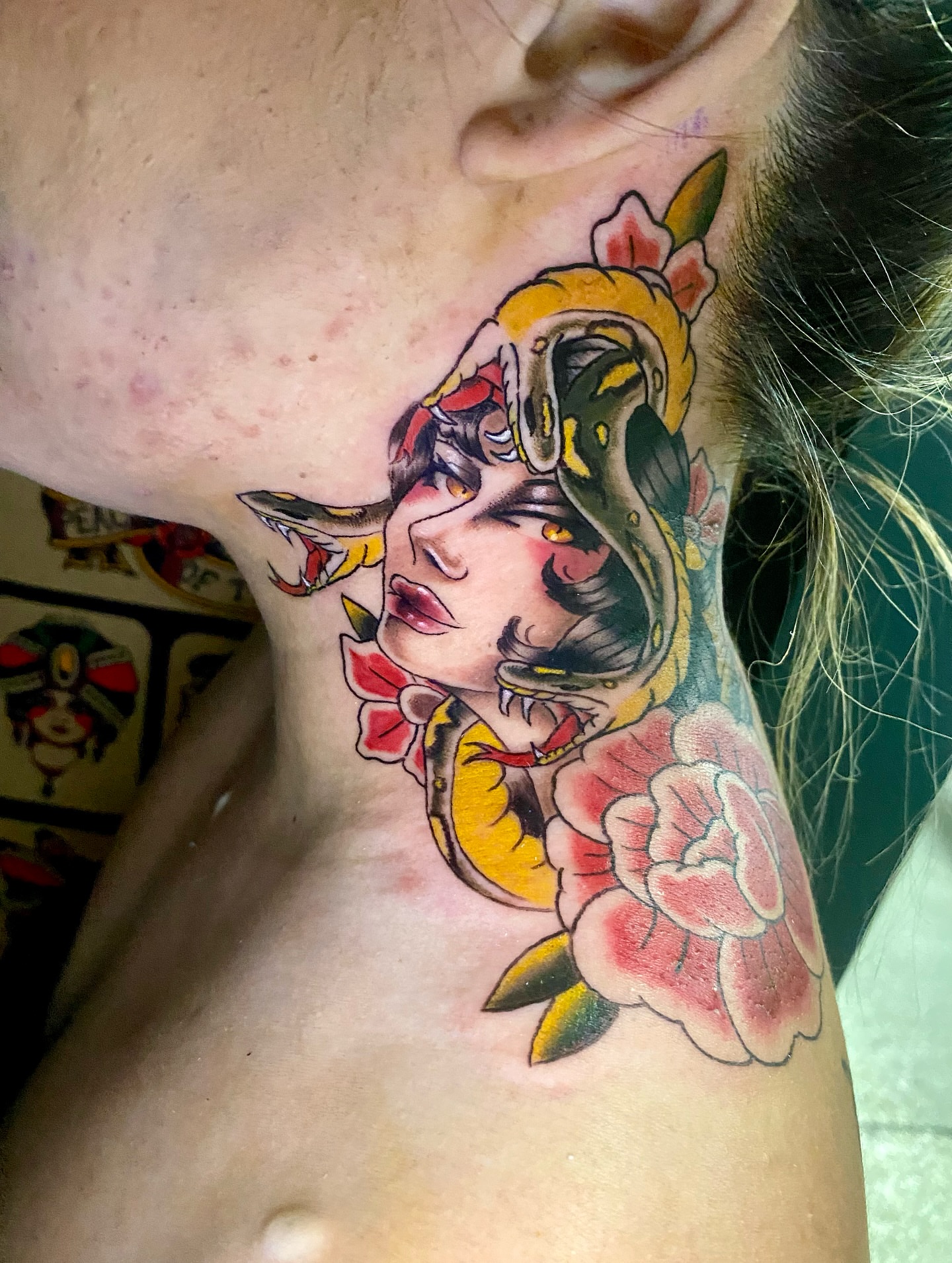 Woman with snake American traditional tattoo on the neck by Ashley Lin Las Vegas Tattoo Artist