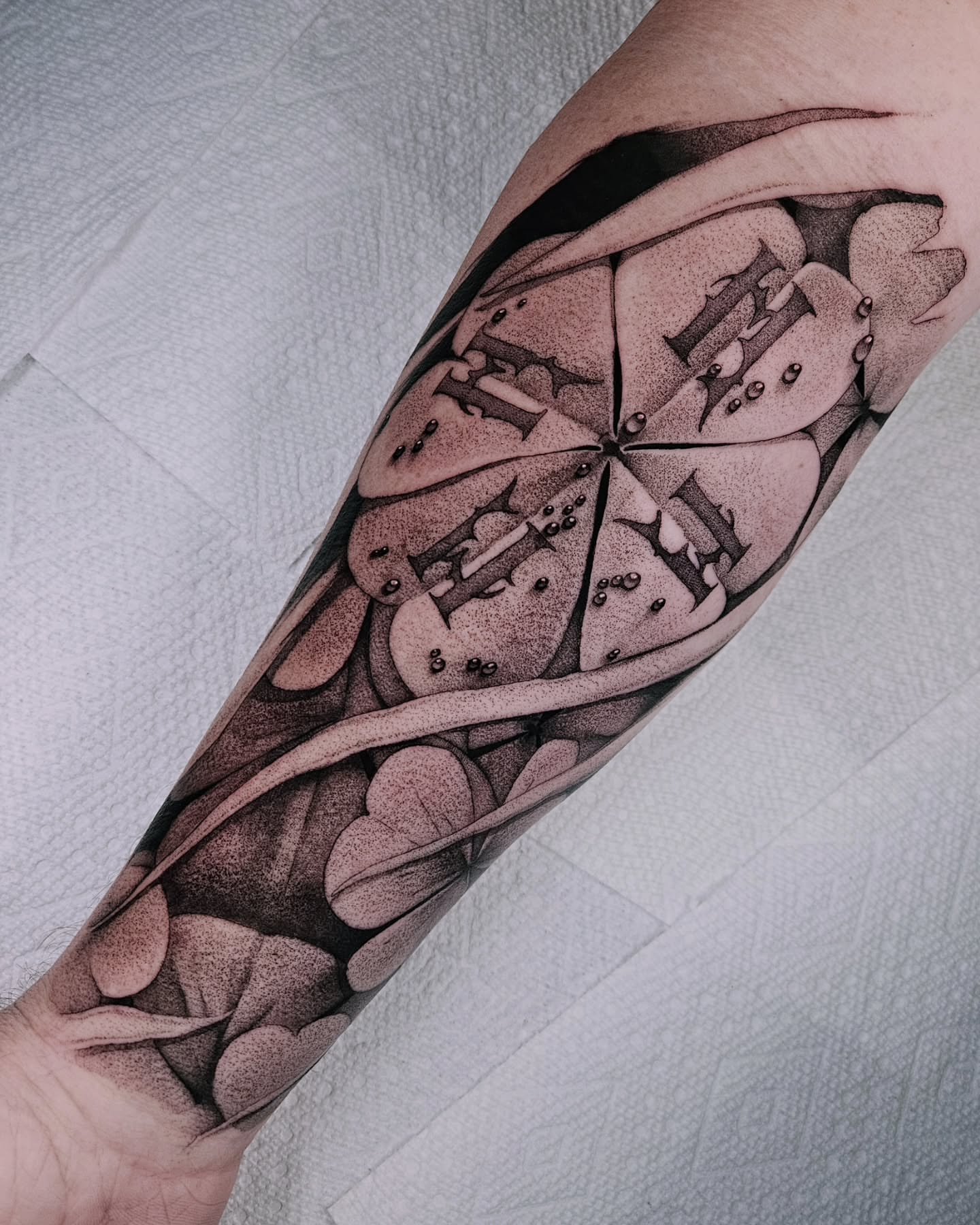 Abstract geometric shapes dotwork tattoo on the forearm by Sabrina Wagner