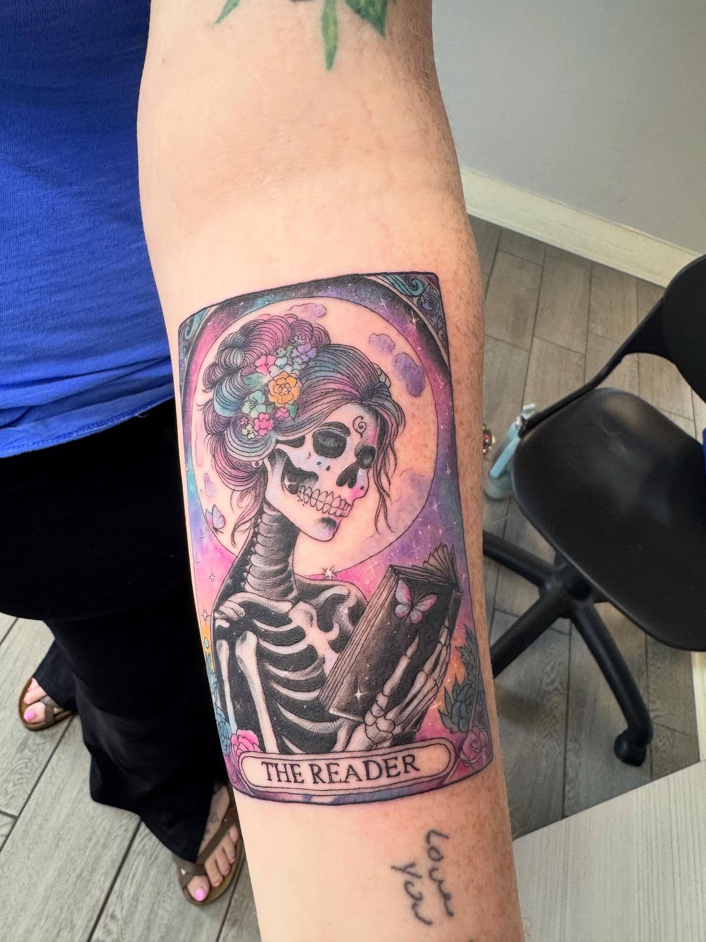 The reader tarot card realism tattoo on the forearm by Joey Flaherty