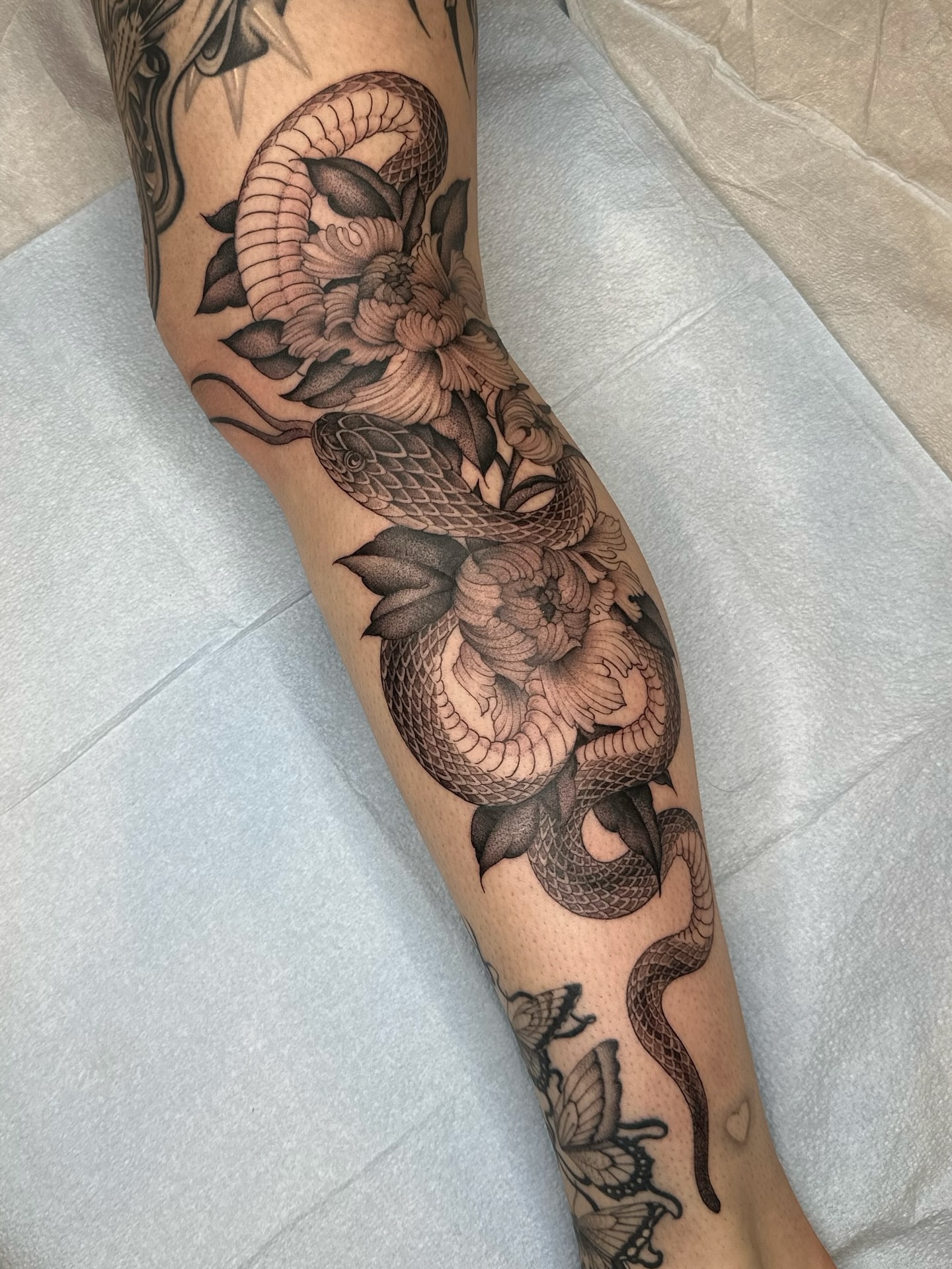 Snake and peony realism tattoo on the forearm by Адріянна Стабс 🇺🇦, New York, New York