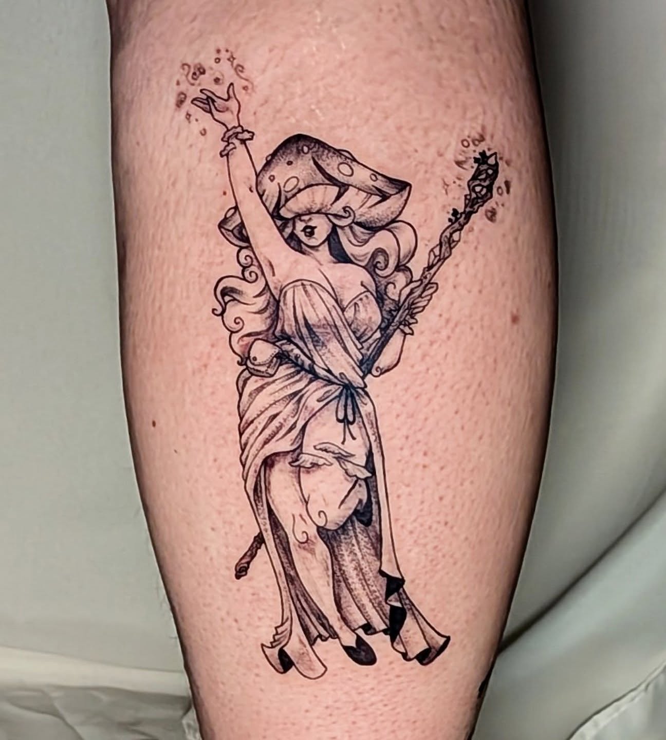 Elf with staff dotwork tattoo on the thigh by Shannon