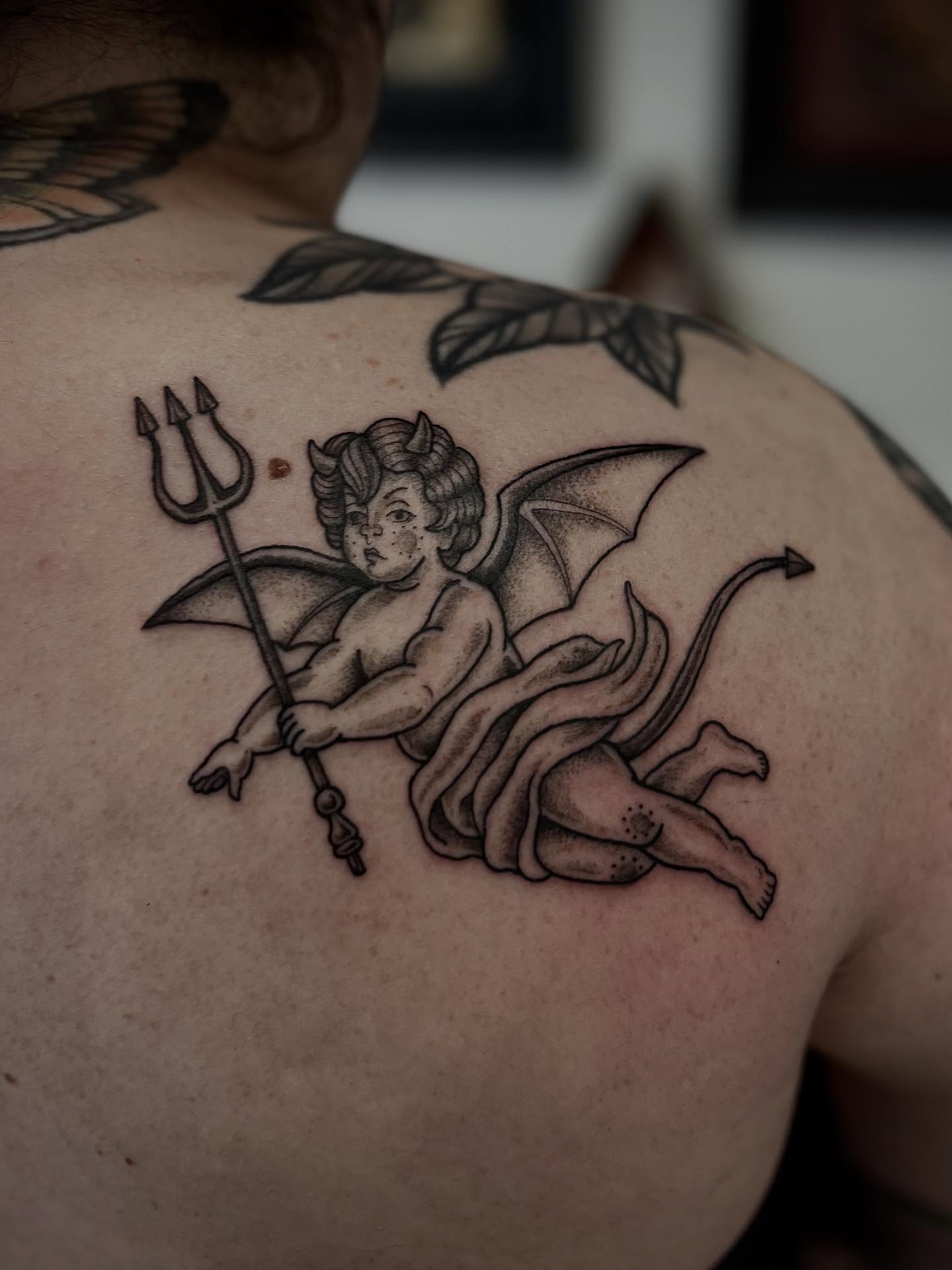 Cherub with trident dotwork tattoo on the back by โถ ๐๐๐๐๐๐๐๐ ๐๐๐ค๐ค๐๐ (๐๐ฆ๐ค๐ฅ๐ช)