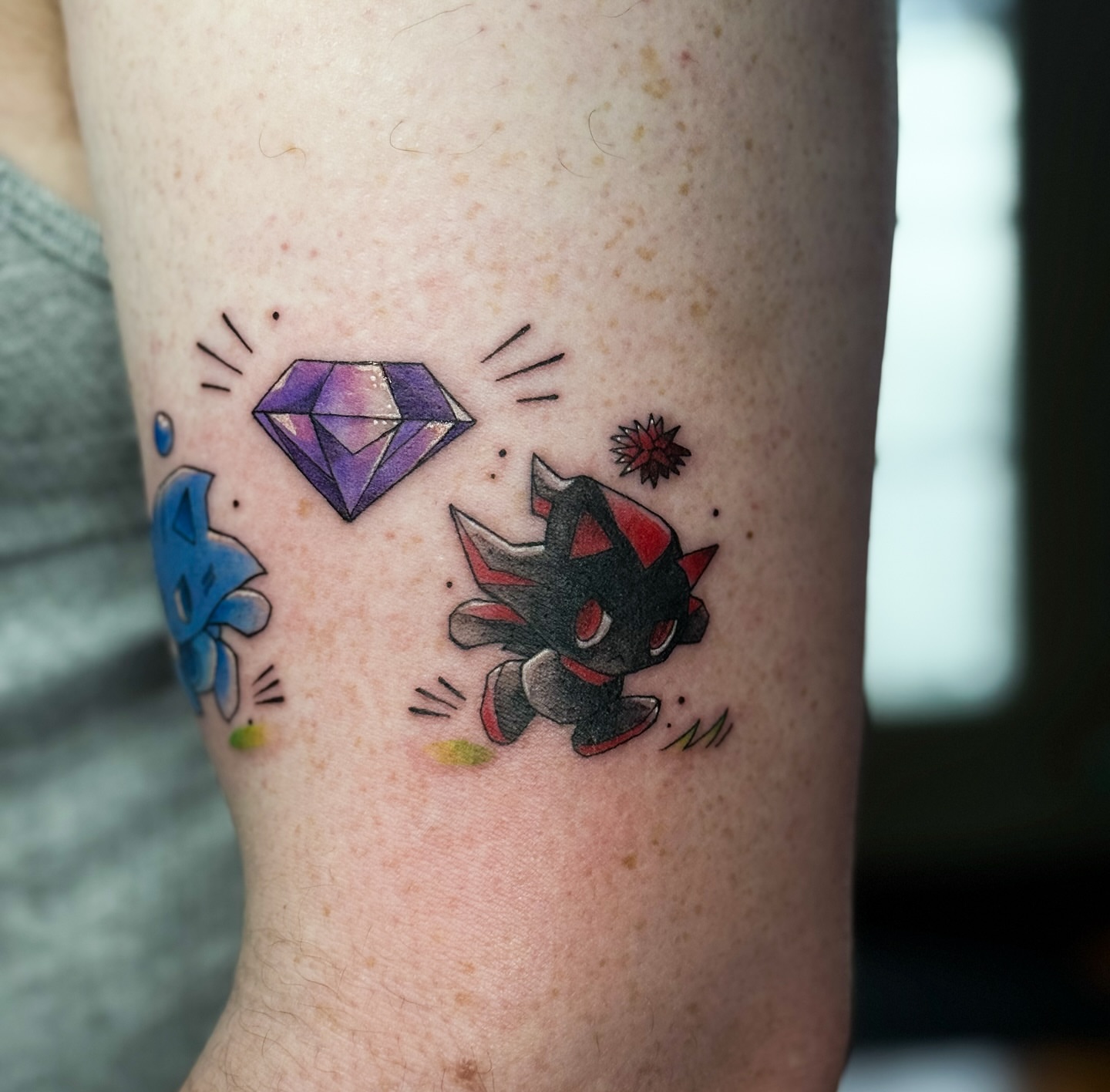 Diamond and Pokémon geometric tattoo on the forearm by Jynx