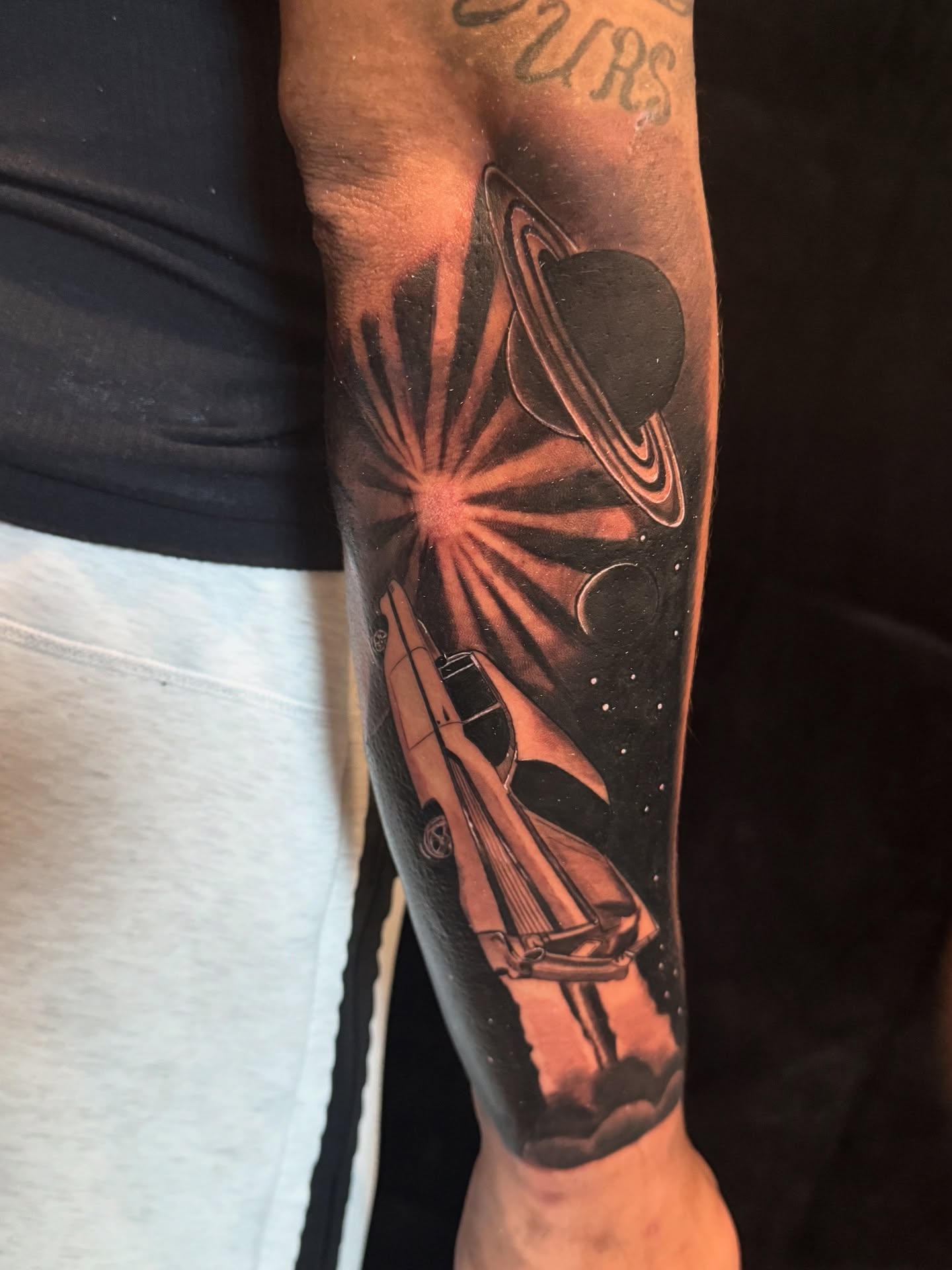 Space shuttle and Saturn realism tattoo on the forearm by Elian Sanchez Austin Tx. Tattoo Artist