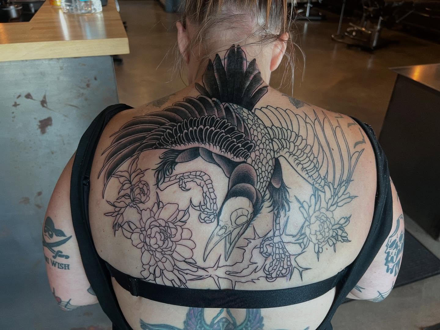 Bird and floral black and grey tattoo on the back by Siërra Nicole, Minneapolis, Minnesota