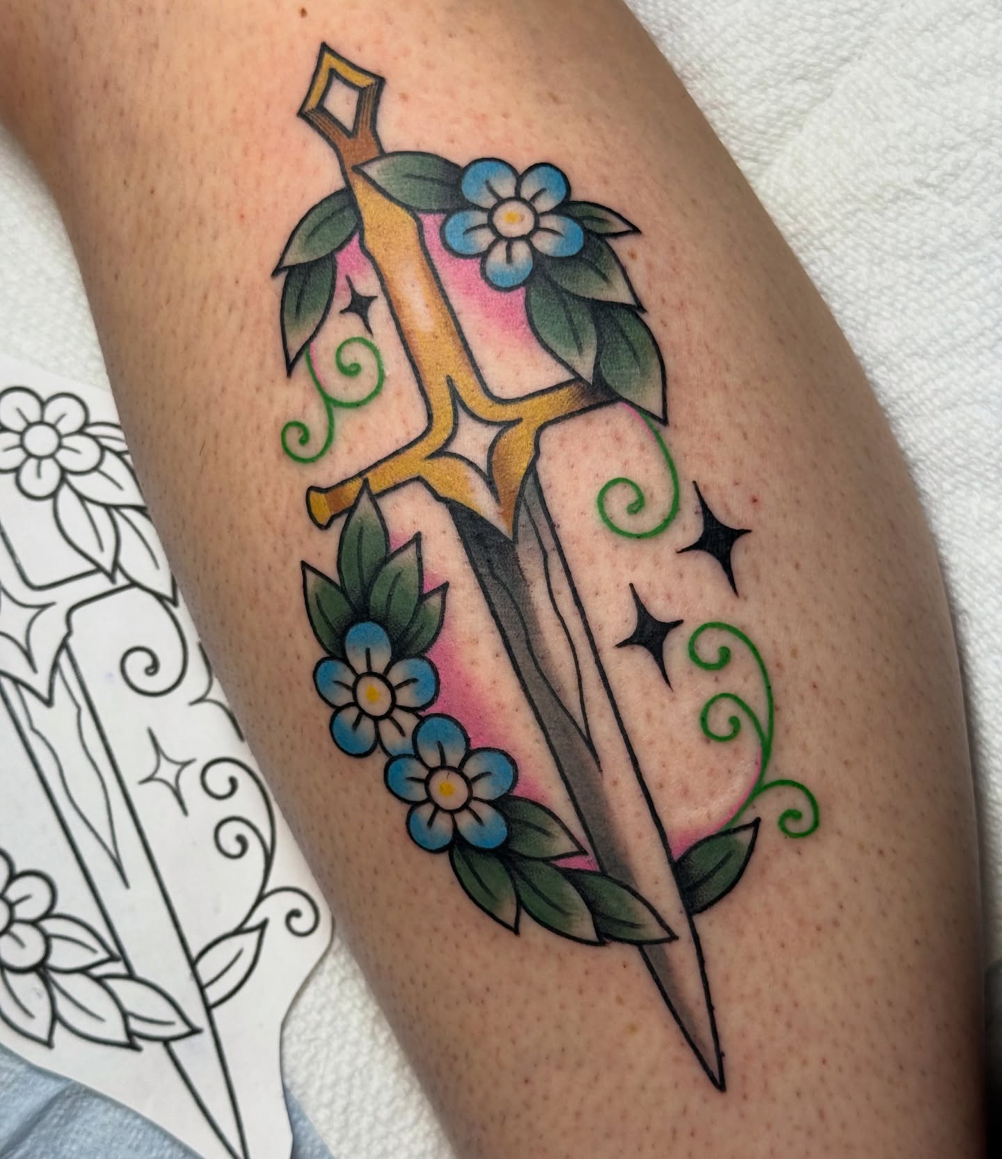 Sword and flowers American traditional tattoo on the thigh by vic