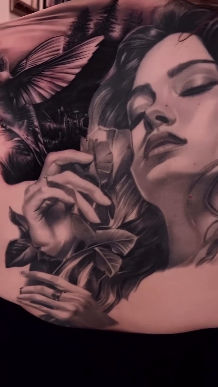 Woman with bird and rose realism tattoo by Erick Gutierrez, Las Vegas, Nevada