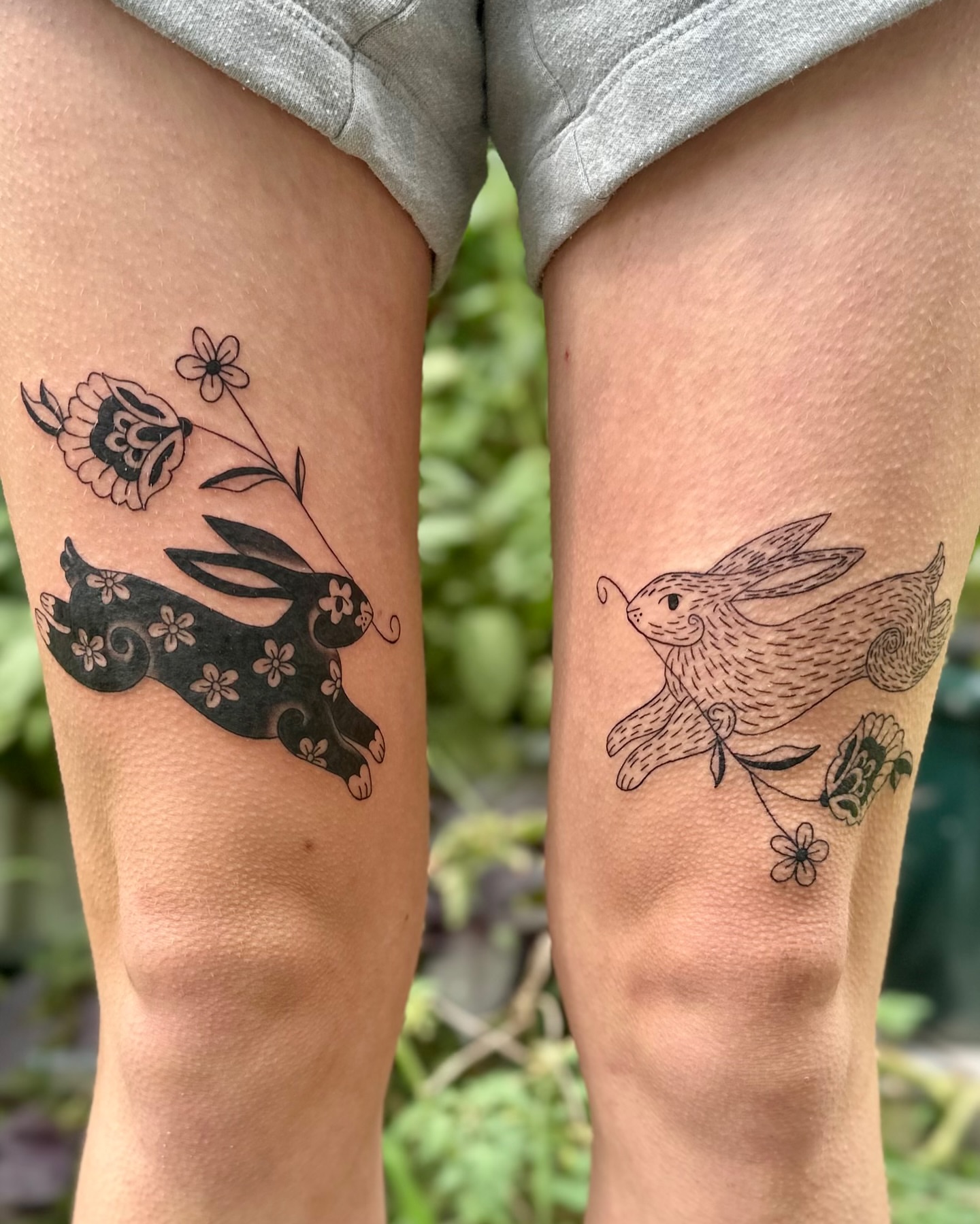 Bunny and flowers black and grey tattoo on the thigh by 🌼Kristen Kooster Tattoos🌼