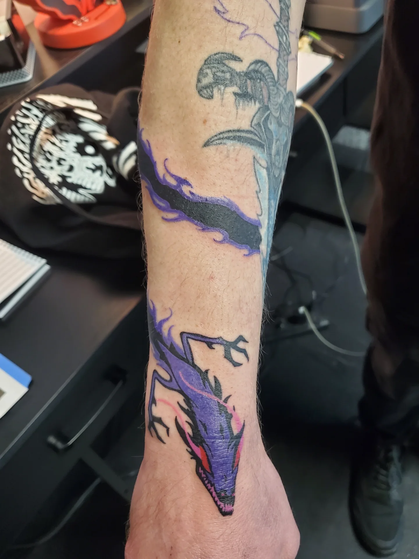 Dragon new school tattoo on the forearm by Shailey Pasquale