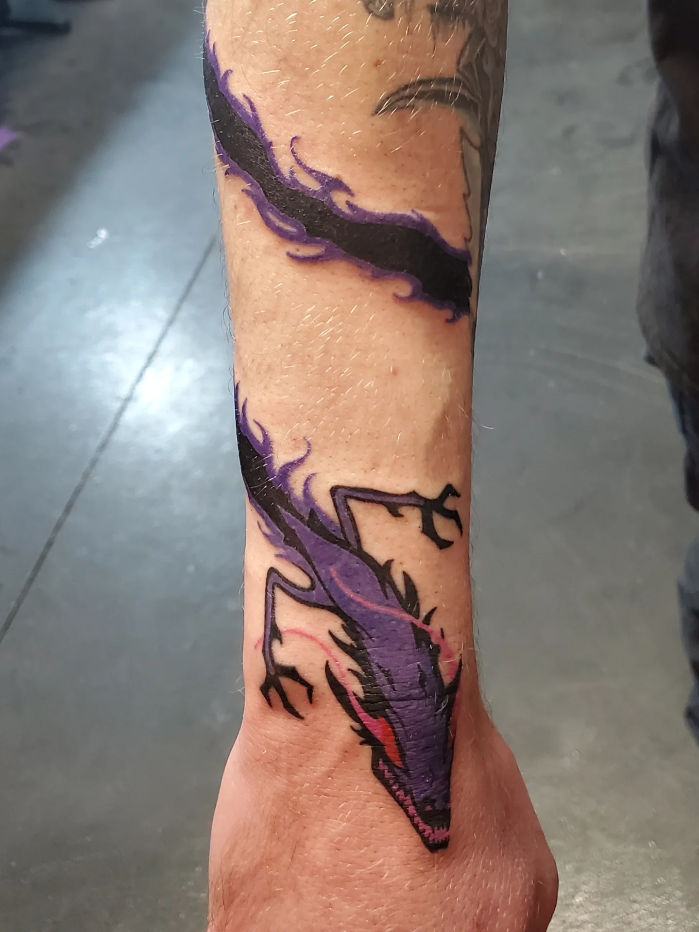 Dragon new school tattoo on the forearm by Shailey Pasquale