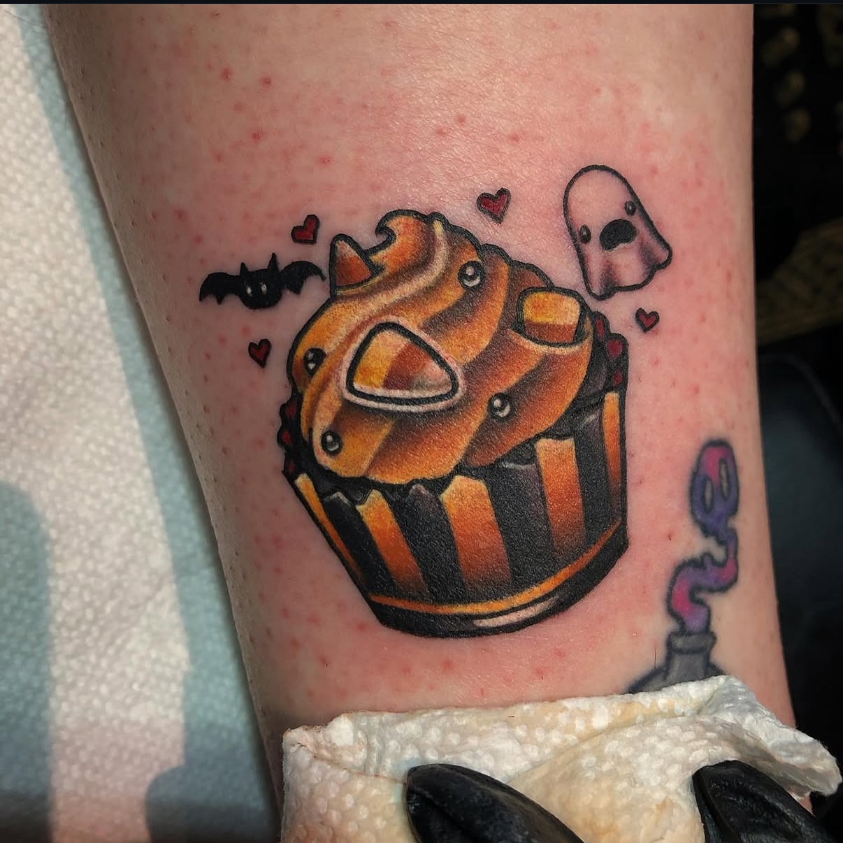 Cupcake new school tattoo on the forearm by Alexandra Fische