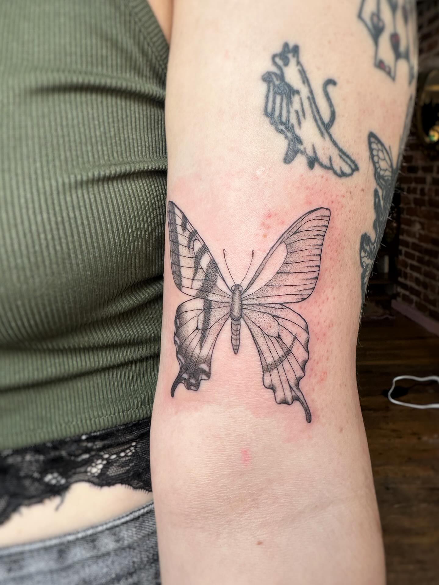 Butterfly black and grey tattoo on the forearm by J Valentin