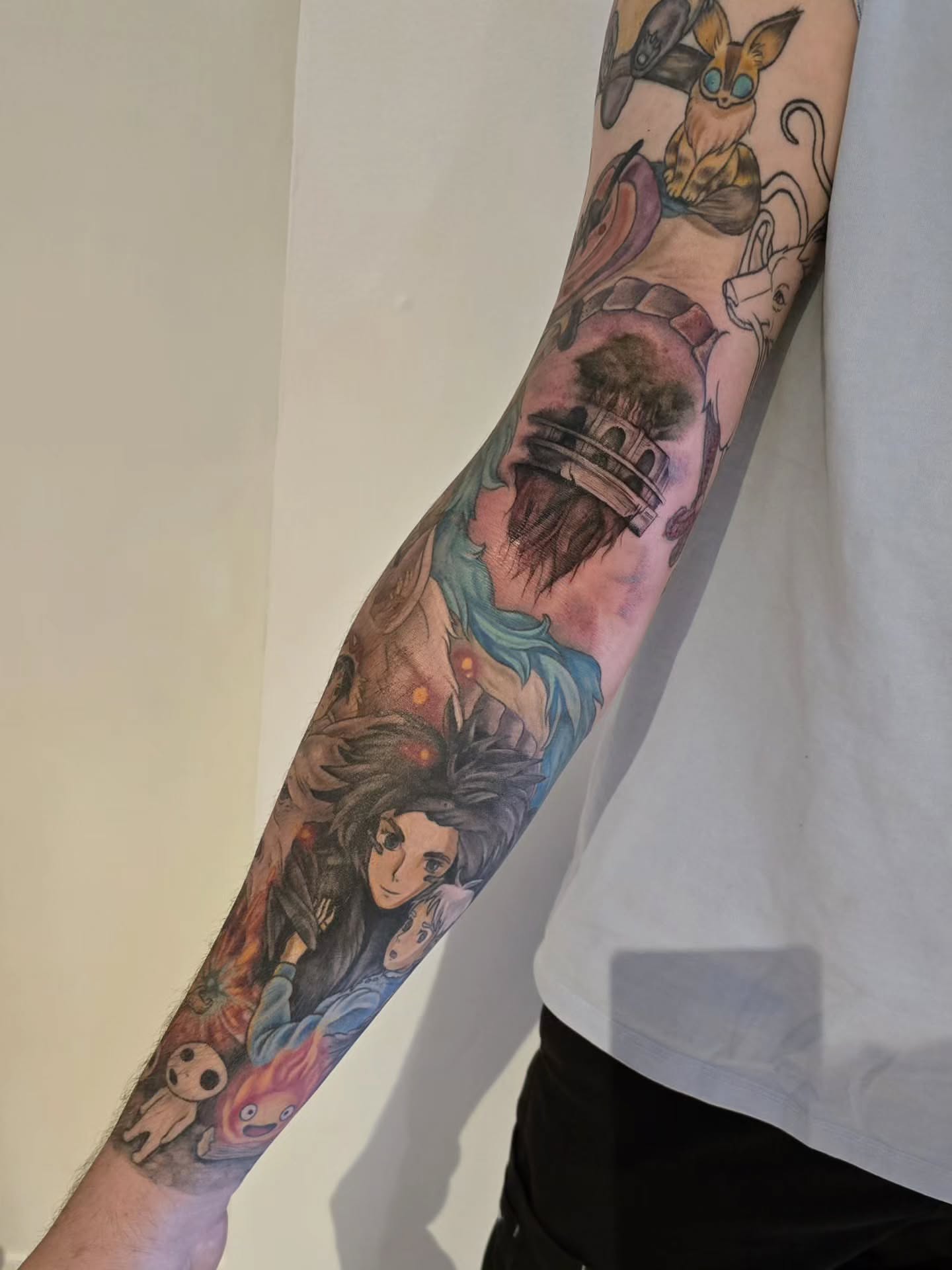 Anime characters anime tattoo on the forearm by Lynx, Cincinnati, Ohio