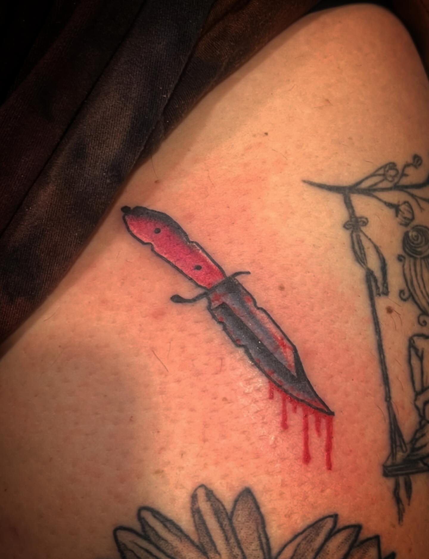 Knife with blood black and grey tattoo on the shoulder by Don Juan