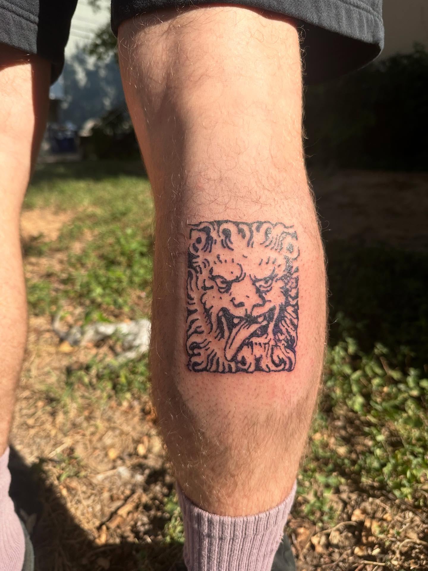 Lion black and grey tattoo on the calf by Swag Originator