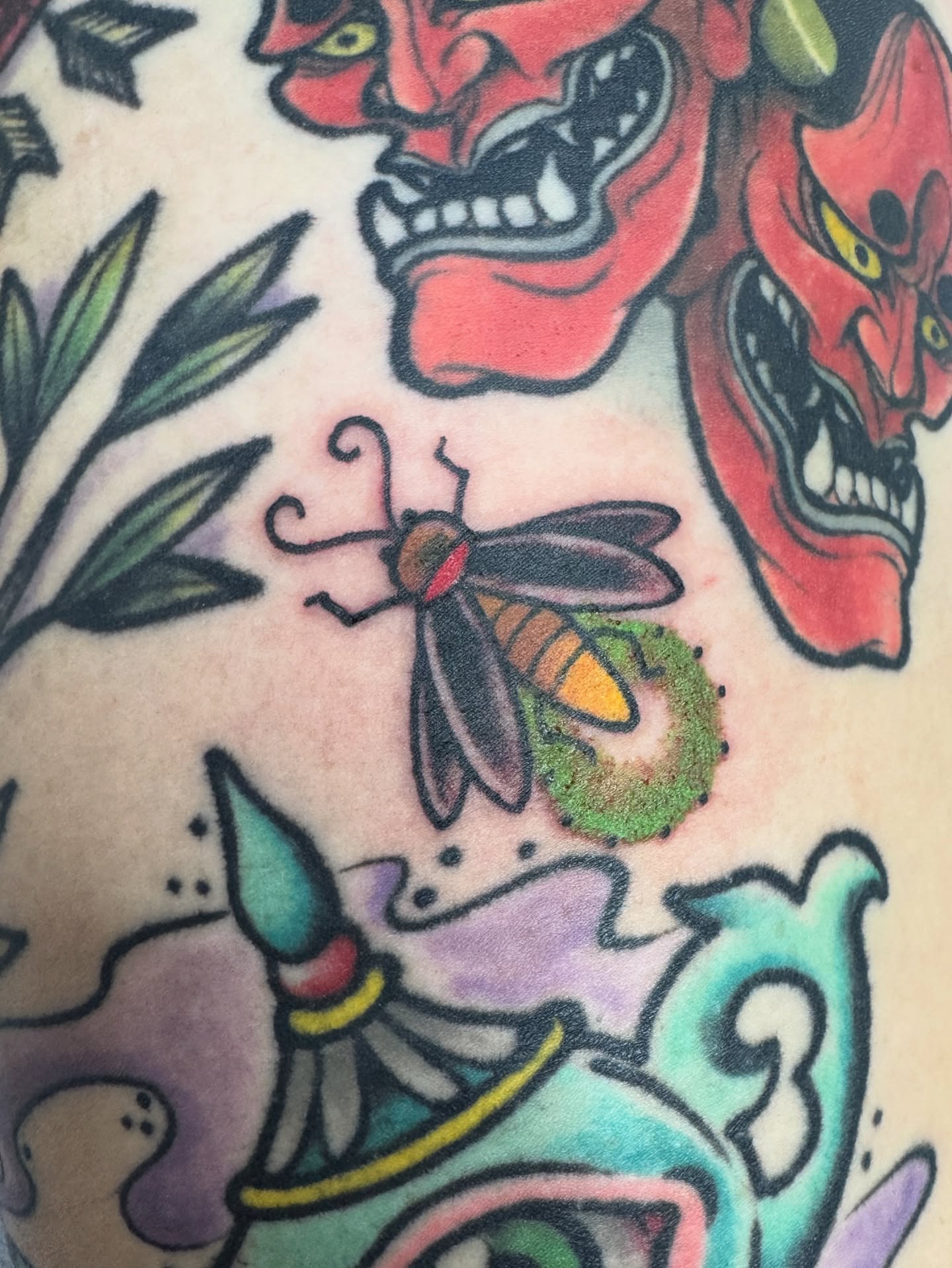 Insect and demons American traditional tattoo on the upper arm by Cary Aldridge